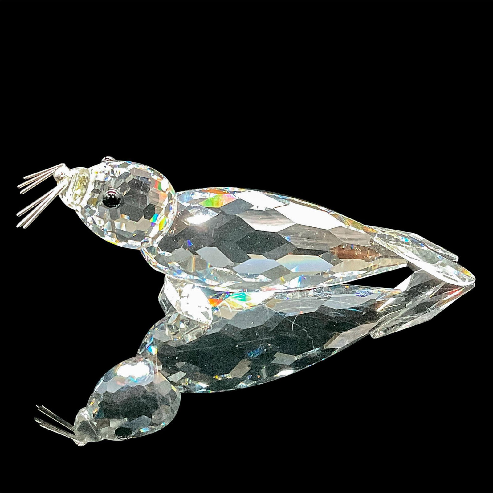 Swarovski Crystal Figurine, Large Seal: The clear crystal seal has black eyes, and it is believed to be the first issue of the large seal available in the USA. Swarovski etched backstamp. This item has its original box which measures 6.5"H 