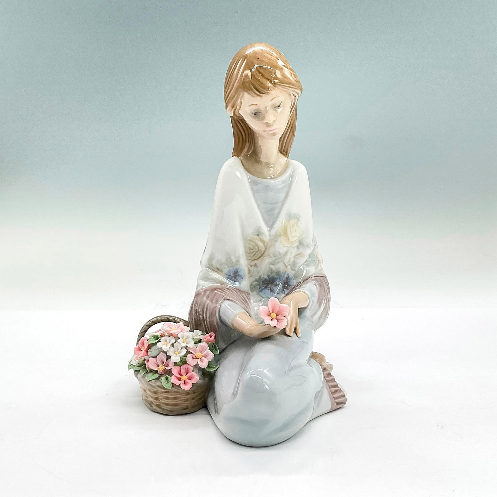 Flower Song 1007607 - Lladro Porcelain Figurine: Glossy finish; Lladro backstamp. Lladro Museum Collectors Society 1988. Artist: Juan Huerta Issued: 1988 - 1989 Dimensions: 7.5"H x 5.5"W Manufacturer: Lladro Country of Origin: Spain