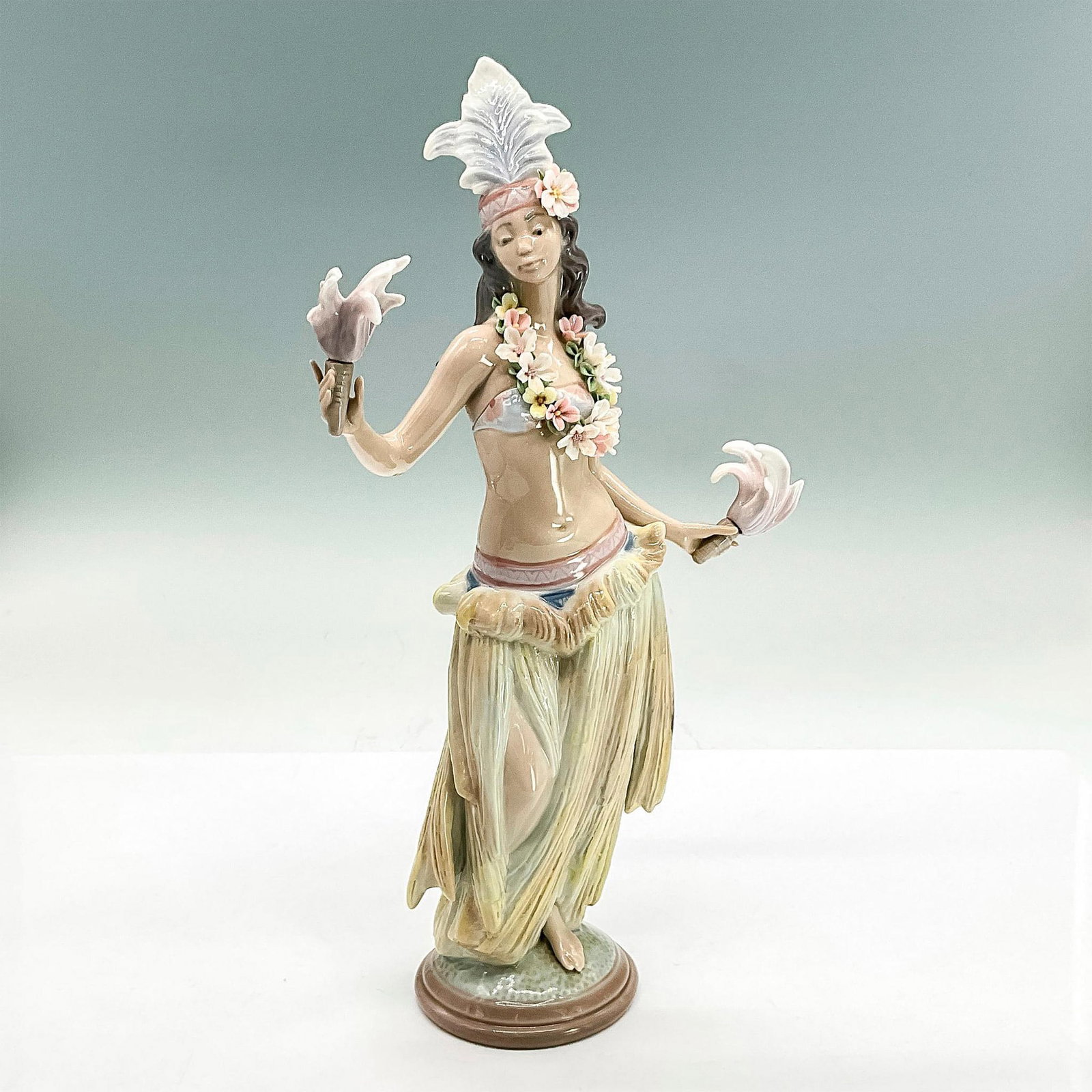 Lehua 1001532 - Lladro Porcelain Figurine: Glossy finish; Lladro backstamp. Artist: Salvador Debon Issued: 1987 - 1989 Dimensions: 11"H Manufacturer: Lladro Country of Origin: Spain