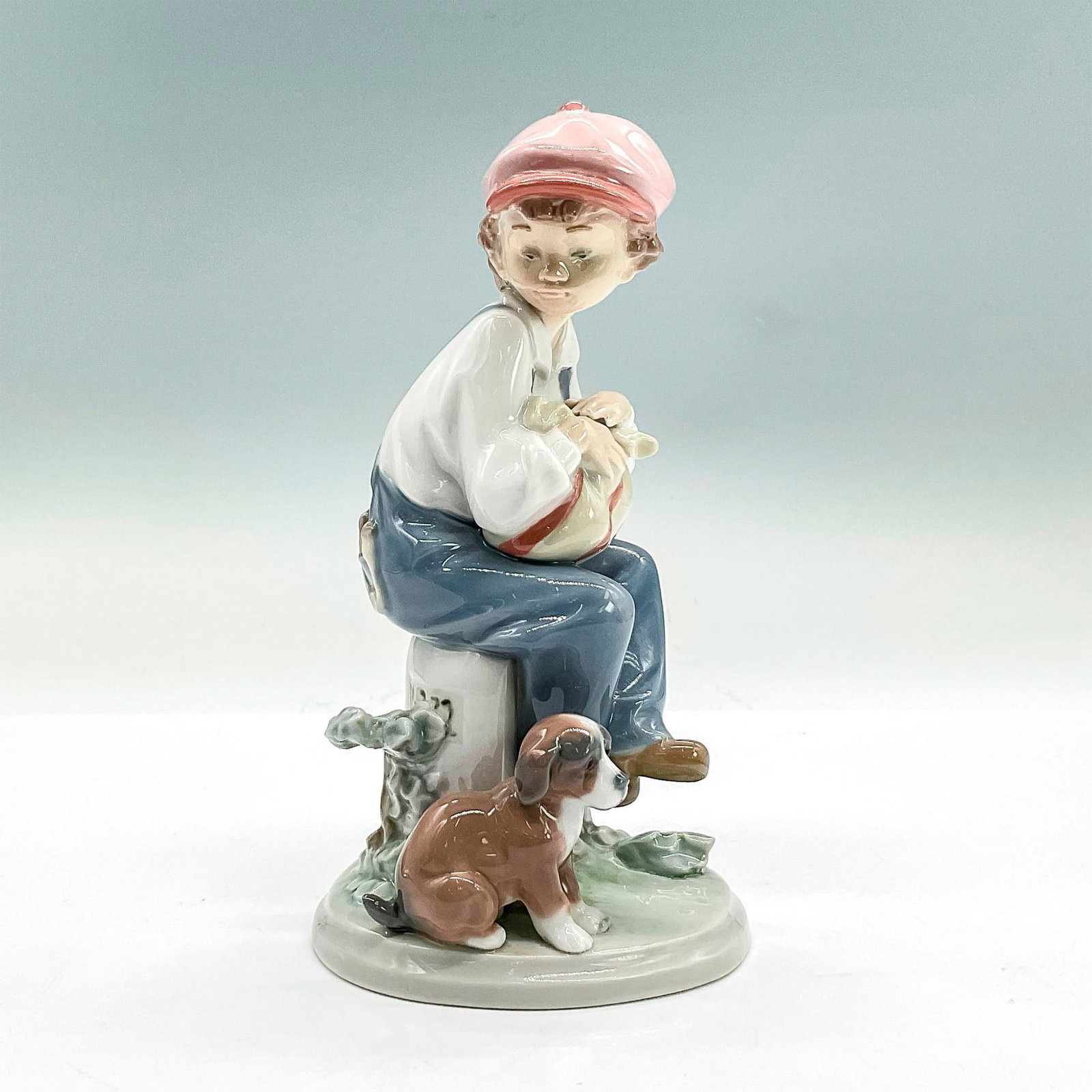 My Best Friend 1005401 - Lladro Porcelain Figurine: Glossy finish; Lladro backstamp. Artist: Antonio Ramos Issued: 1987 - 1998 Dimensions: 6.75"H x 3.5"W Manufacturer: Lladro Country of Origin: Spain