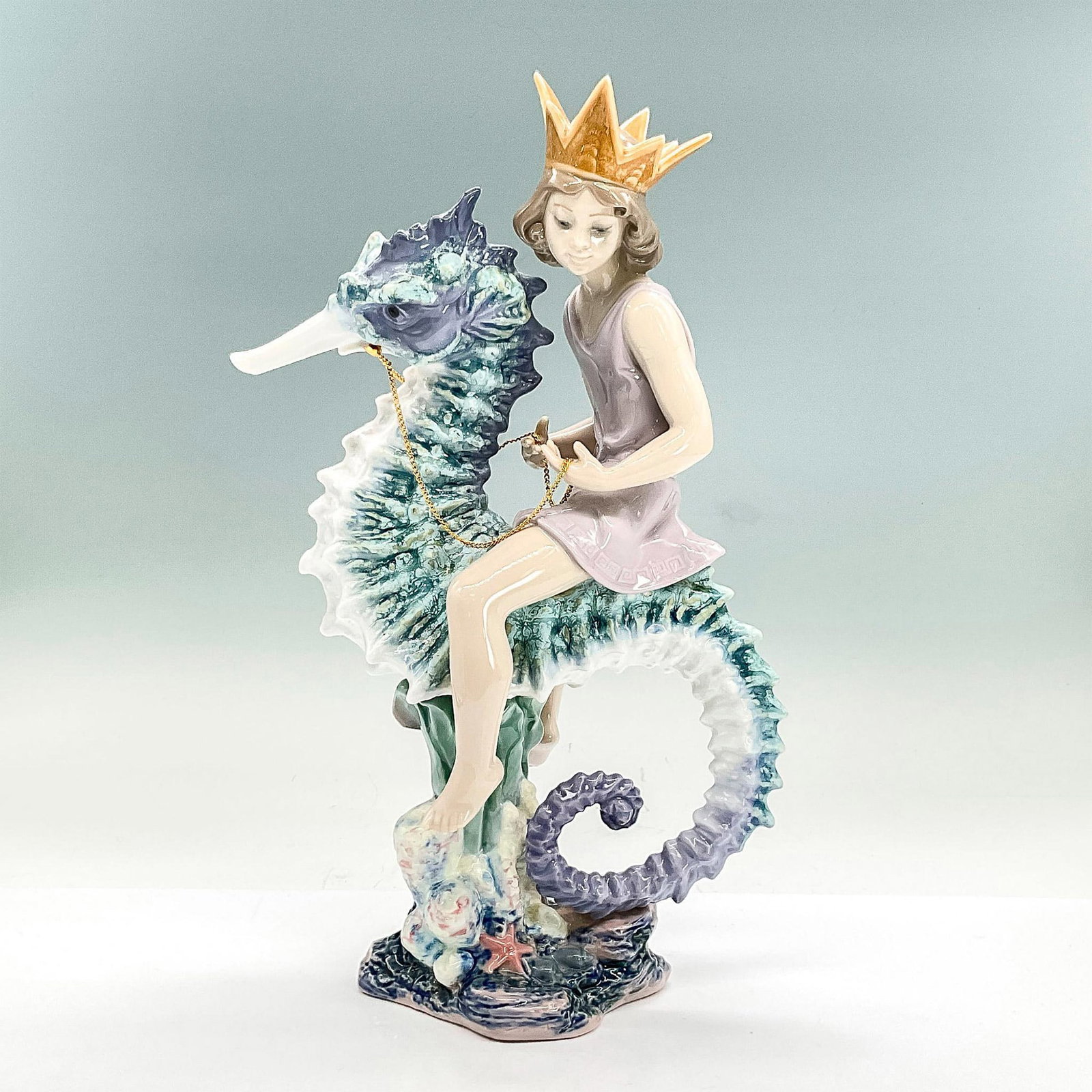 Prince Of The Sea 1001821 Ltd. - Lladro Porcelain Figurine: Glossy finish; Lladro backstamp. Signed. No.124. Artist: Francisco Polope Issued: 1997 - 2005 Dimensions: 12.5"H x 6.75"W Manufacturer: Lladro Country of Origin: Spain