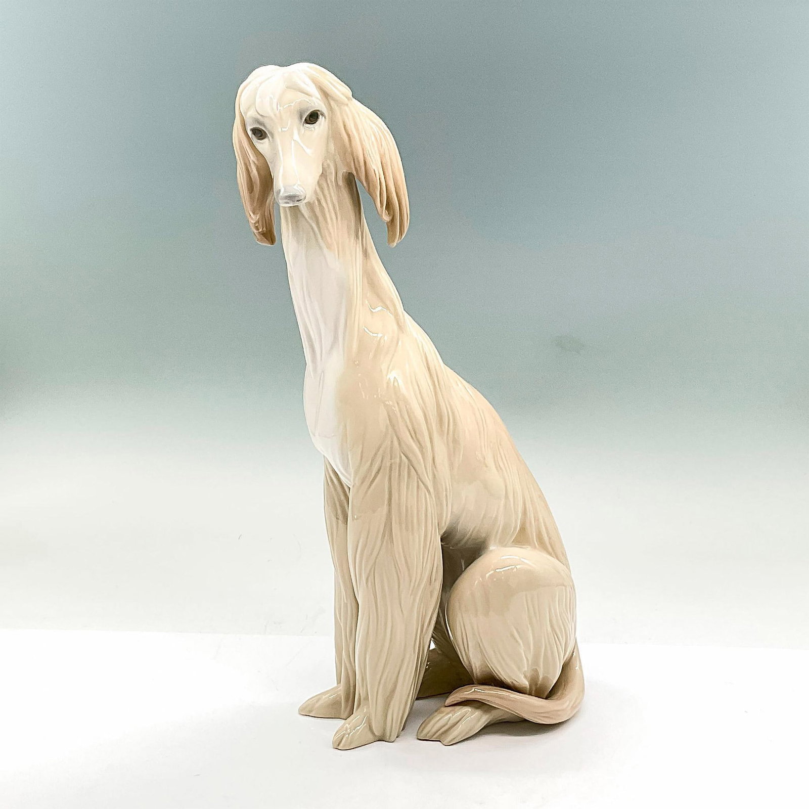 Afghan 1001069 - Lladro Porcelain Figurine: Glossy finish; Lladro backstamp. Artist: Juan Huerta Issued: 1969 - 1985 Dimensions: 11.5"H Manufacturer: Lladro Country of Origin: Spain