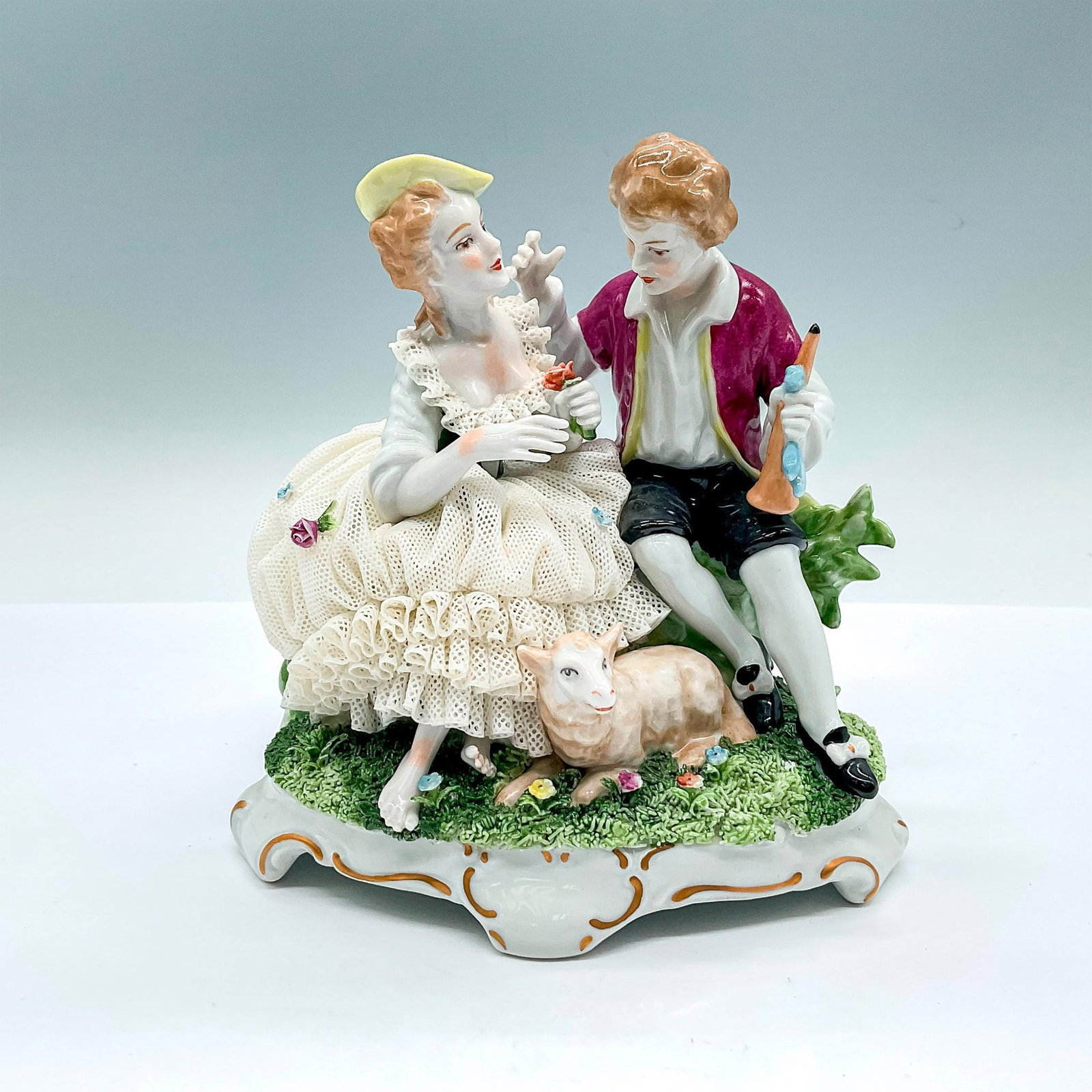 Unterweissbach German Porcelain Shepherd Lace Figurine: A beautiful group figure of a shepherd wooing a shepherdess in lace dress. Unterweissbach marked. Dimensions: 6.5"L x 4.75"W x 6.25"H Manufacturer: Unterweissbach Country of Origin: Germany