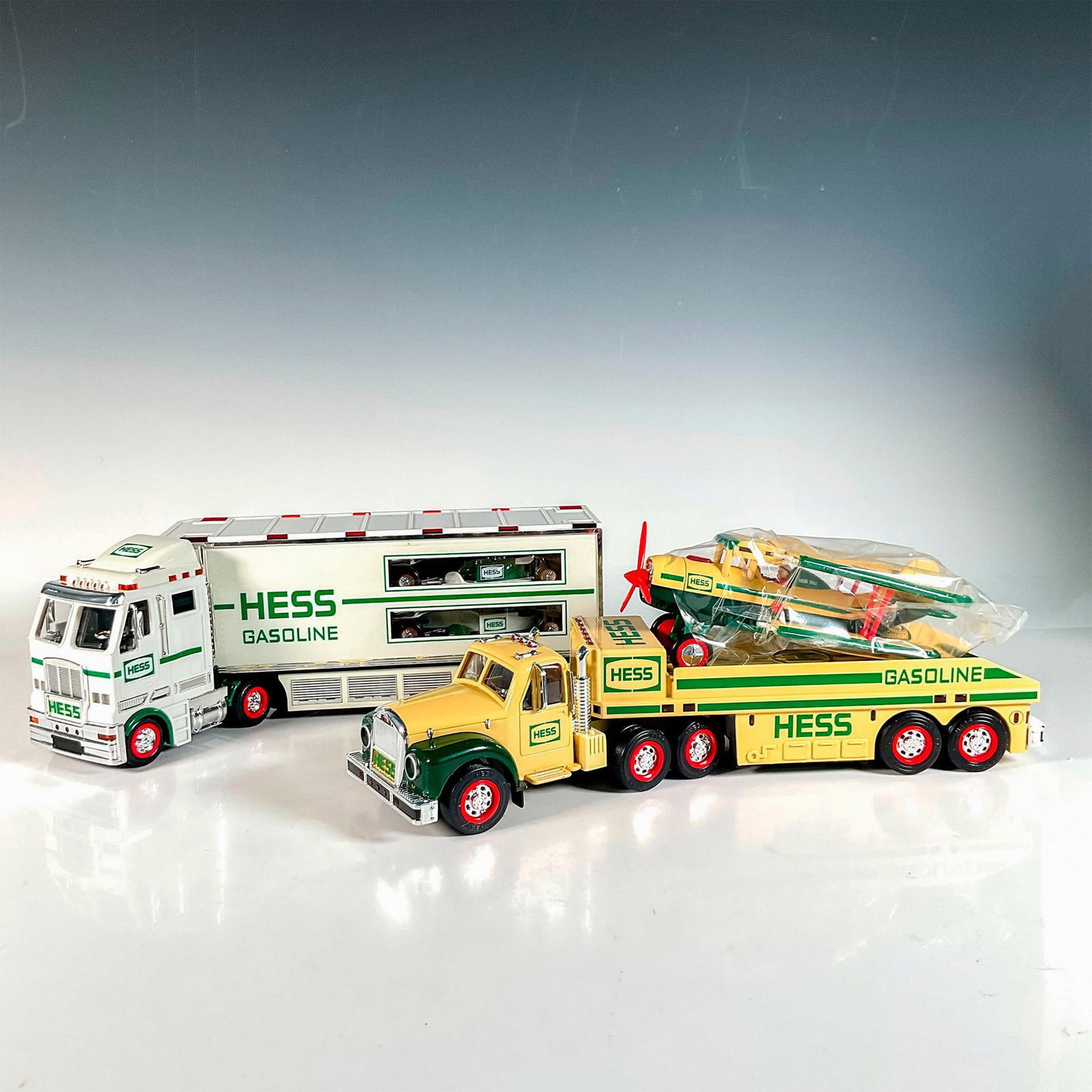 2pc Hess Toy Truck Collectible: 2002 Toy Truck and Airplane and 2003 Toy Truck and Racecars. Battery operated collectibles with sounds, lights, and flashers. This item has its original boxes. Longest box measures: 15.5"L x 3.75"W x
