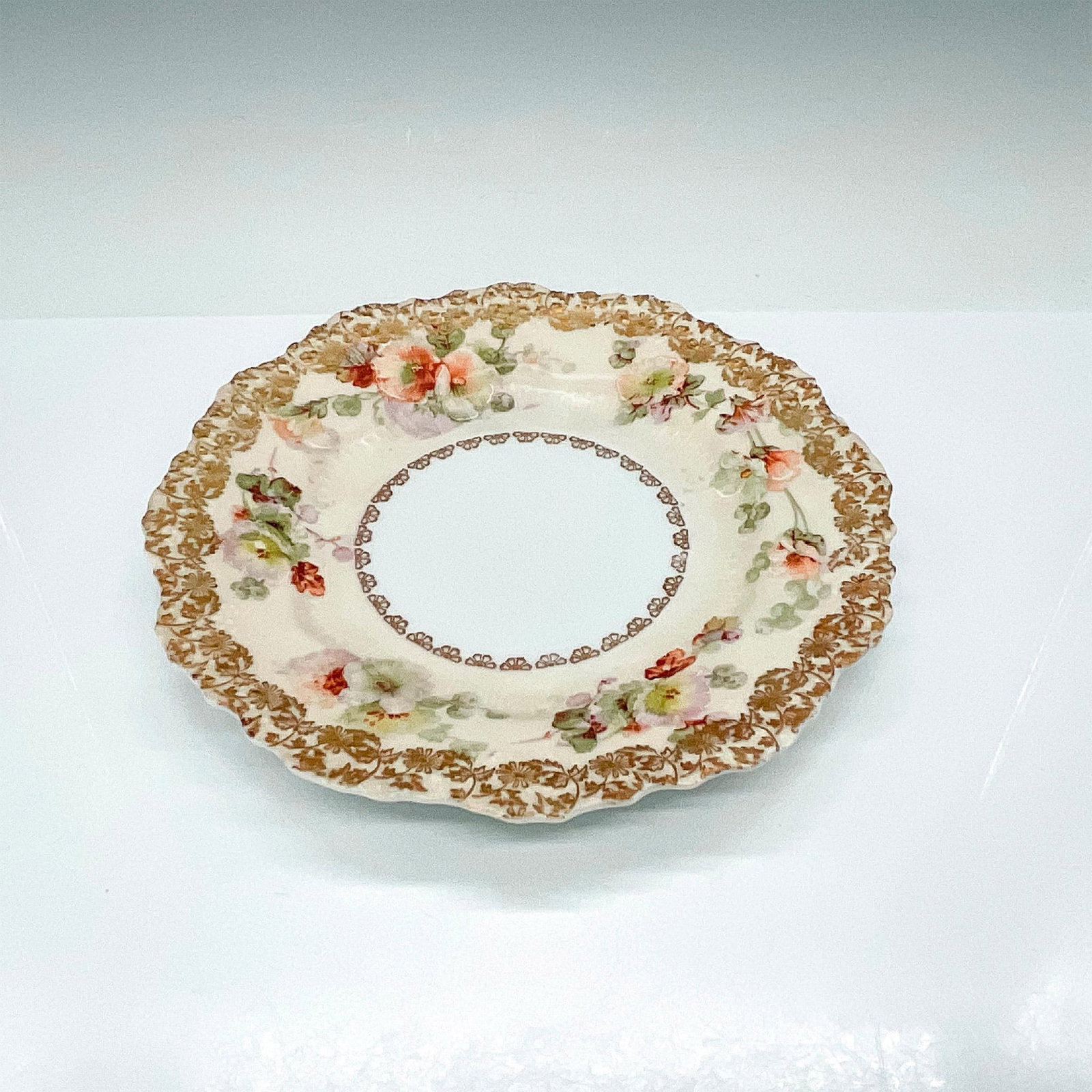 OHME of Silesia Porcelain Dish, Old Ivory Pattern: Beautiful antique dish from the porcelain manufactory Hermann Ohme produced in Silesia. Decorated with gorgeous hand painted flowers on a cream-colored background and finished with gold embellishments