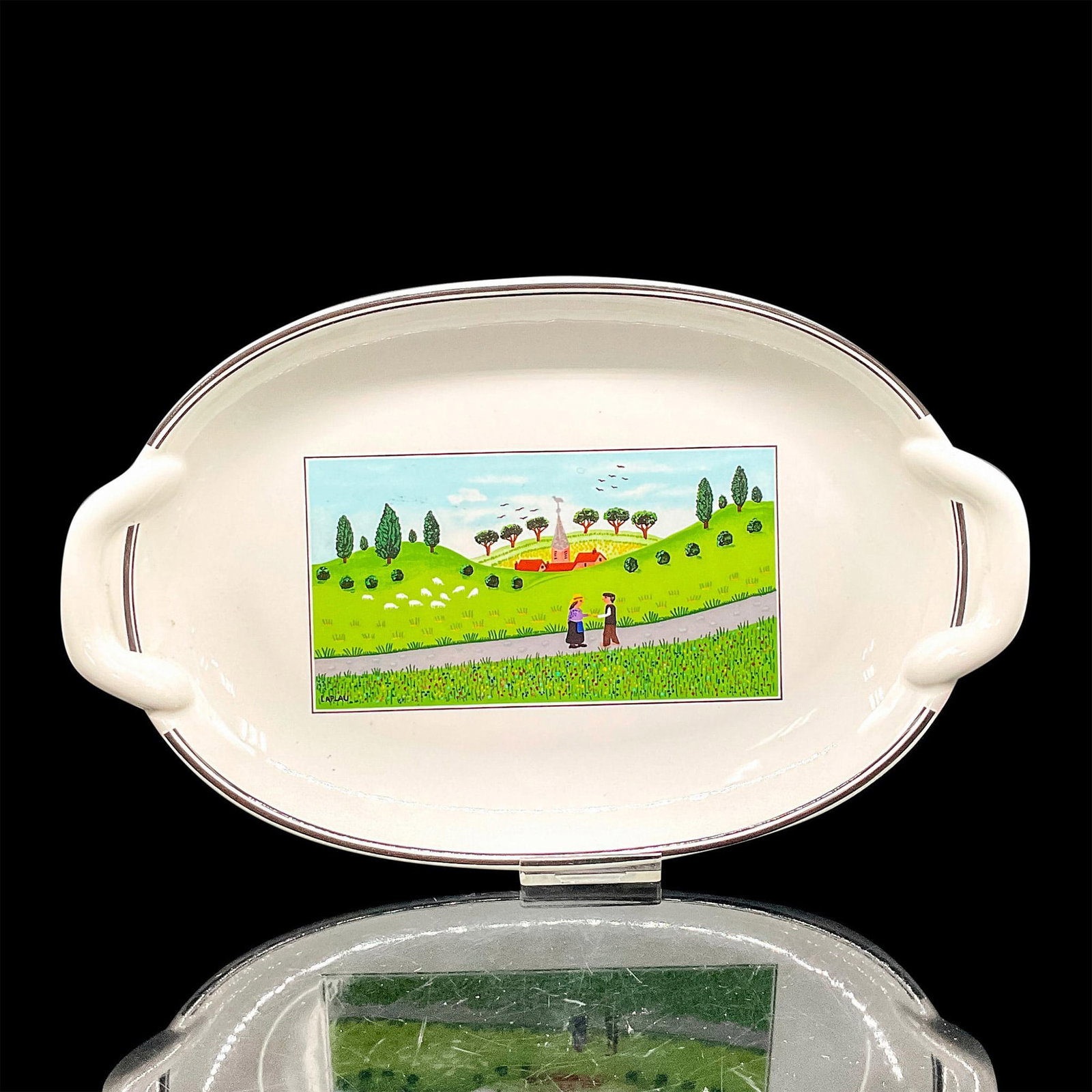 Villeroy & Boch Porcelain Oval Serving Plate, Design Naif: White porcelain plate with a quaint countryside scene of two people on a road. Green hills, sheep grazing, and a building are seen in the background. Villeroy & Boch backstamp. Dimensions: 10"L x 6"W 