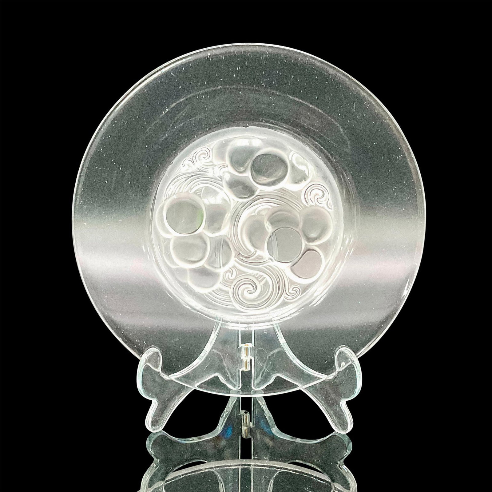 Lalique Glass Dessert Plate, Marienthal: A clear round plate with a frosted grape and vine design. Dimensions: 0.5"H x 7"dia Manufacturer: Lalique Country of Origin: France Provenance: Collection of Marie-Claude Lalique