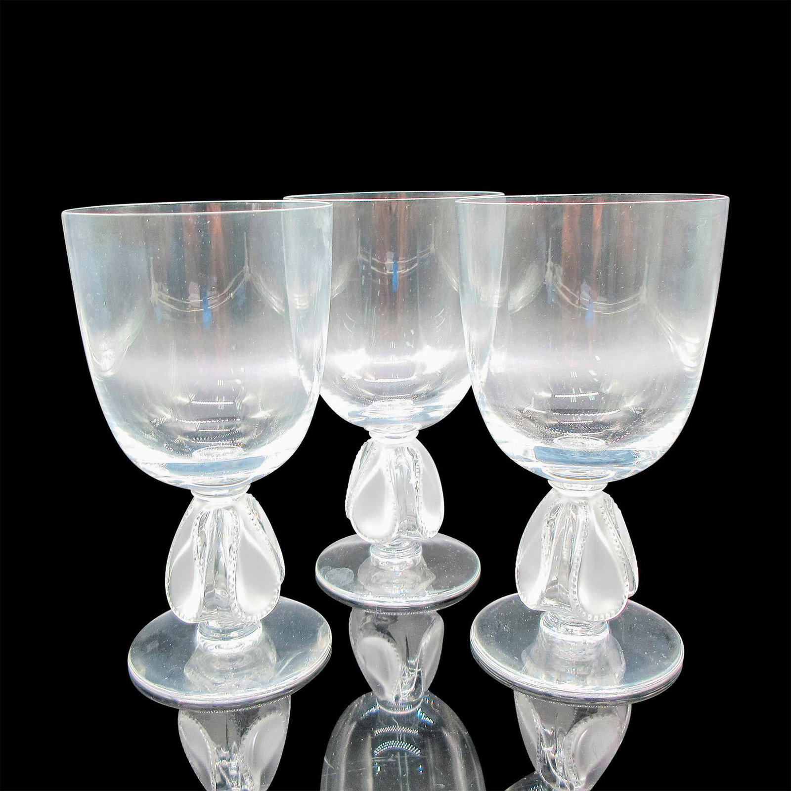 3pc Lalique Crystal Wine Glasses, Bellini: Clear glass body with frosted teardrop in raised dimpled design. Lalique etched mark. Issued: 1991-1995 Dimensions: 3"L x 3"W x 5.25"H Manufacturer: Lalique Country of Origin: France Provenance: