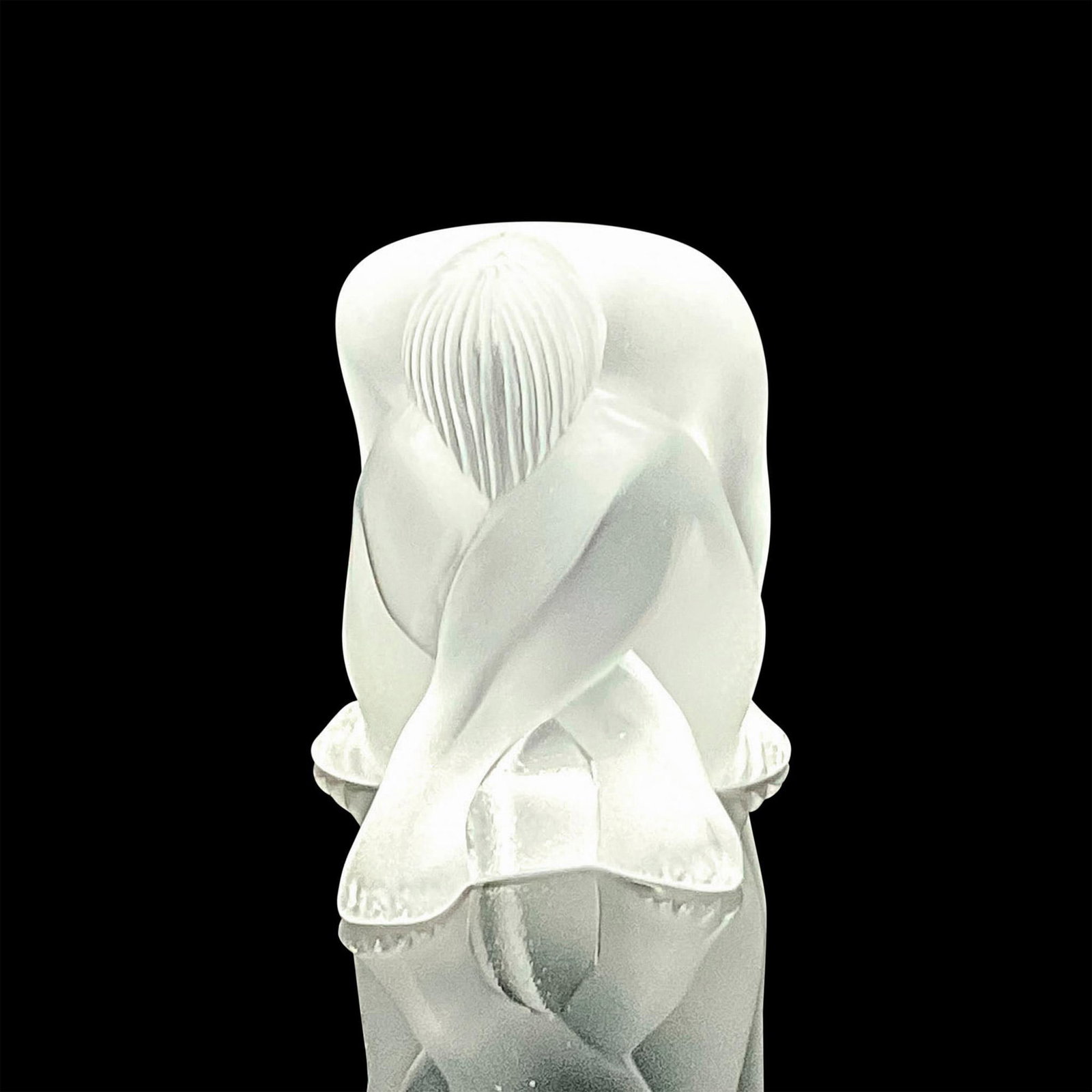 Lalique Crystal Sculpture, Nu Assis: A small satin finished figure of a nude woman with head bow down and hands to her sides. Issued: Late 20th century Dimensions: 2.5"L x 2"W x 2.25"H Manufacturer: Lalique Country of Origin: France Pro