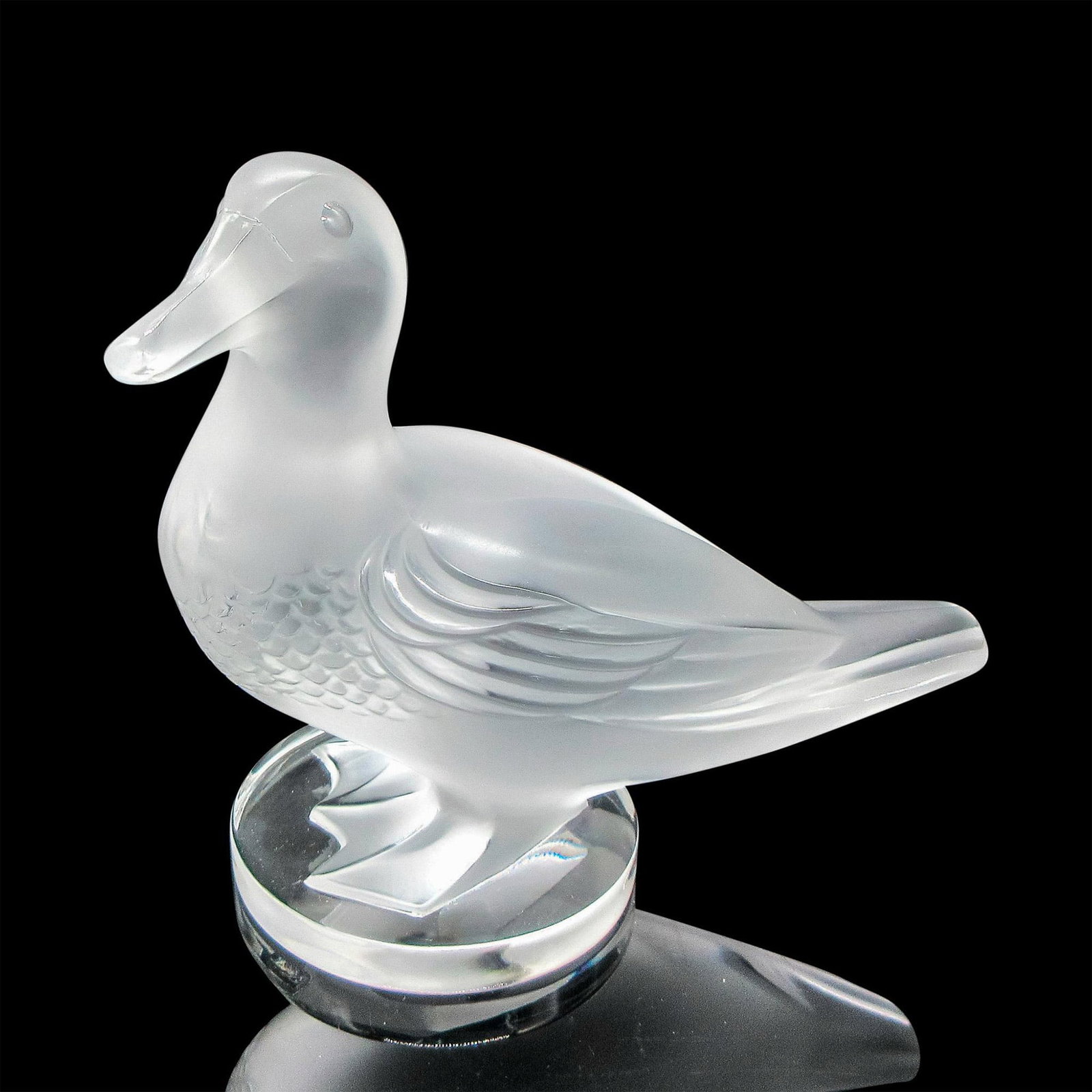 Lalique Frosted Crystal Paperweight, Gedeon Canard: Frosted figural with textured breast, defined wings and webbed feet on clear round base. Lalique etched mark. Dimensions: 5.5"L x 3"W x 5"H Manufacturer: Lalique Country of Origin: France Provenance: 