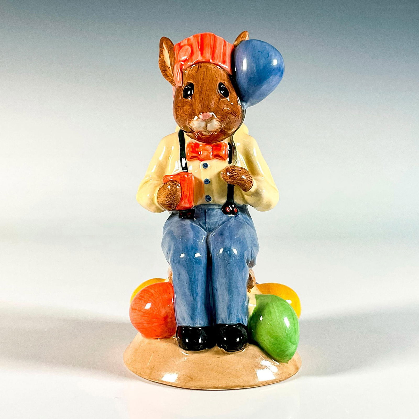 Royal Doulton Bunnykins Toby Jug, Party Time D7160: Limited edition produced exclusively for U.K.I Ceramics Ltd. Features a cute little bunny holding a balloon and cup in hands. Royal Doulton backstamp. Artist: C. Dadd Issued: 2000 Dimensions: 3.25"L x