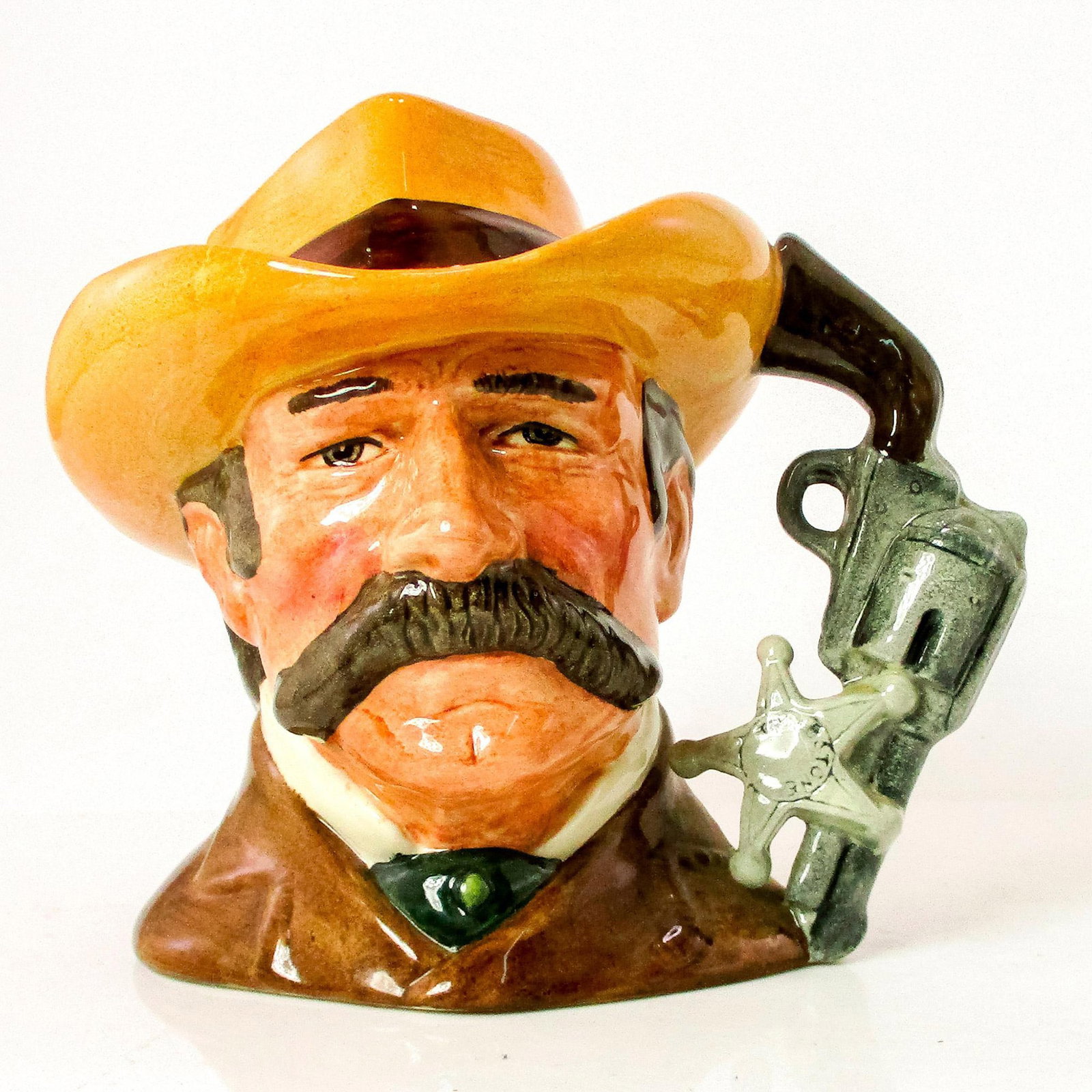 Wyatt Earp D6711 - Odd Size - Royal Doulton Character Jug: Brown coat; light brown hat with red band. Series: The Wild West Collection. Royal Doulton backstamp. Comes with certificate. Artist: Stanley J. Taylor Issued: 1985 - 1989 Dimensions: 5.5"H Manufactur