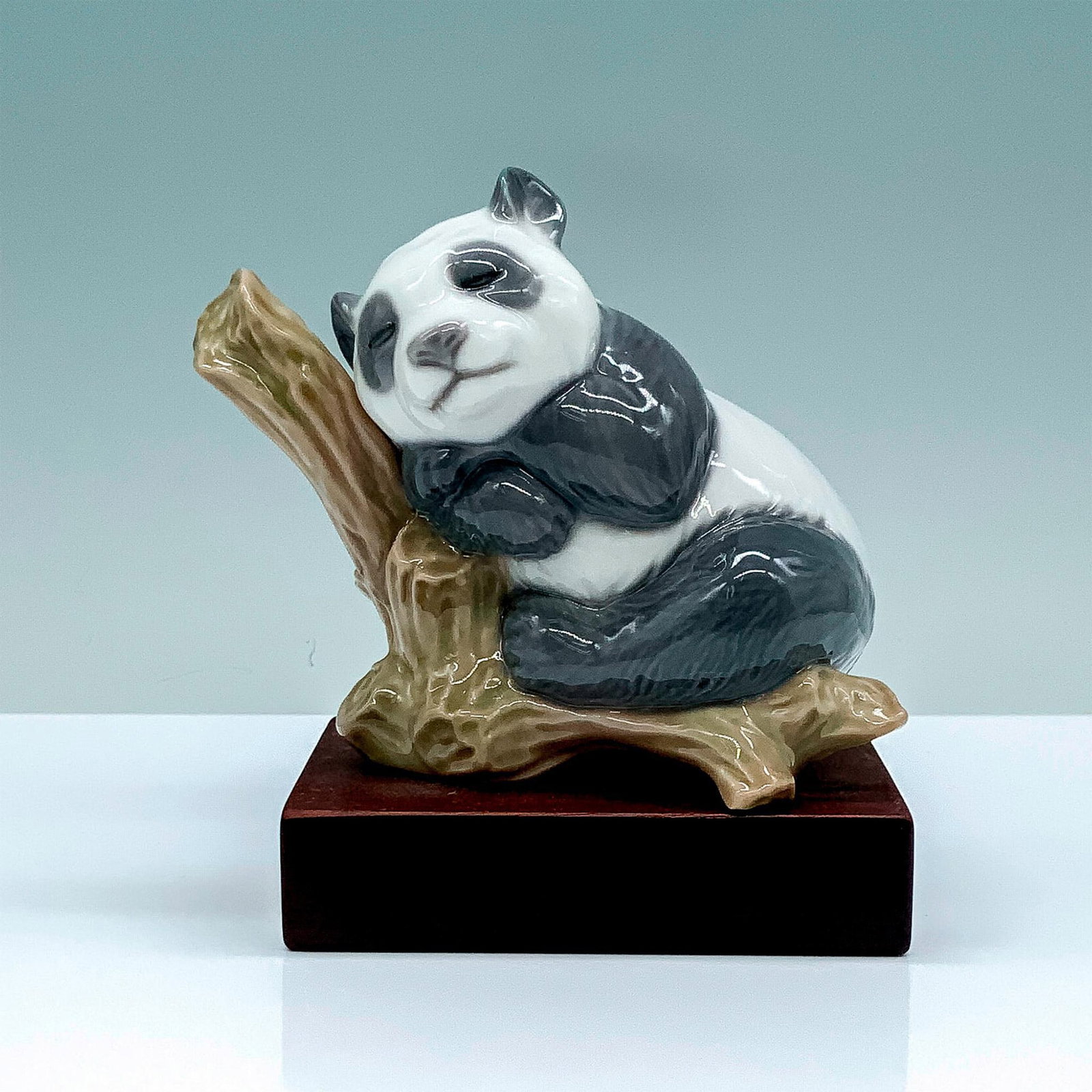 Lucky Panda 1008105 - Lladro Porcelain Figurine + Base: Glossy finish; Lladro backstamp. Includes base. Dimensions of the base: 3.25"L x 2.25"W x 0.75"H. Artist: Francisco Cuesta Issued: 2005 - 2010 Dimensions: 4.5"H x 4"W Manufacturer: Lladro Country
