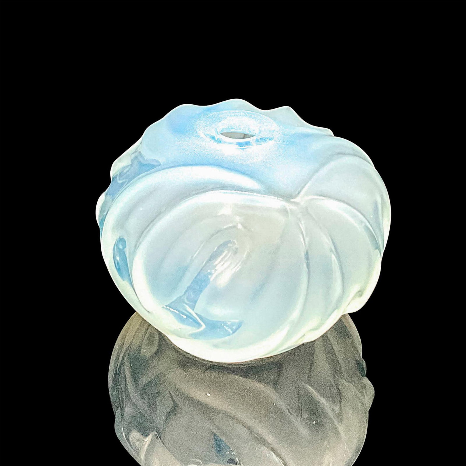 Lalique Crystal Small Opal Bud Vase: A round clear and satin vase with a swirl pattern and luster finish. Opale etched on the base. Dimensions: 2.75"W x 2"H Manufacturer: Lalique Country of Origin: France Provenance: Marie-Claude Lalique