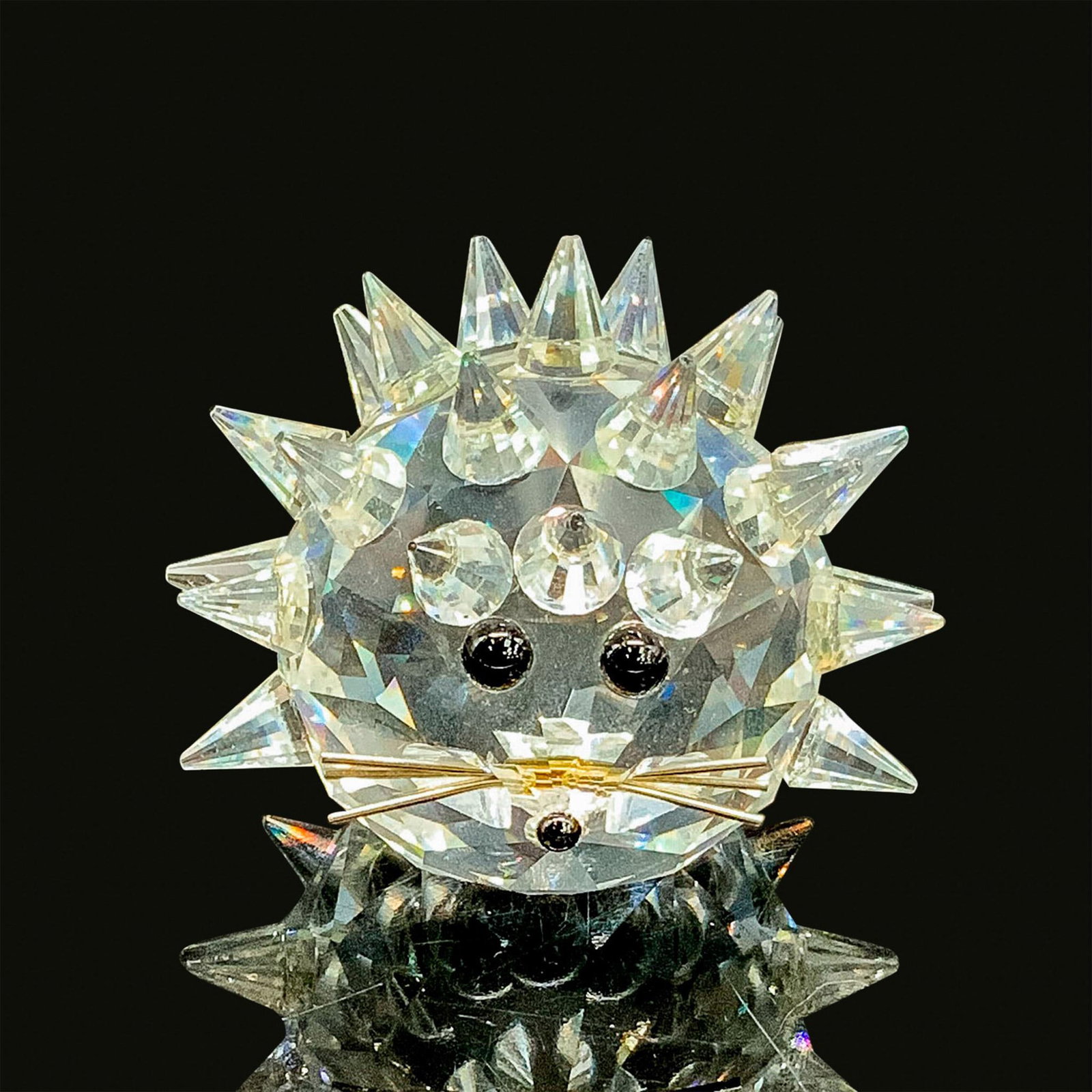 Swarovski Silver Crystal Figurine, Round Hedgehog 7630NR040: This retired hedgehog figurine is made from clear crystal, with black eyes and nose, and silver metal whiskers. Swarovski acid stamp on bottom. The box measures 3.25"dia. x 3.75"H. Artist: Max Schreck