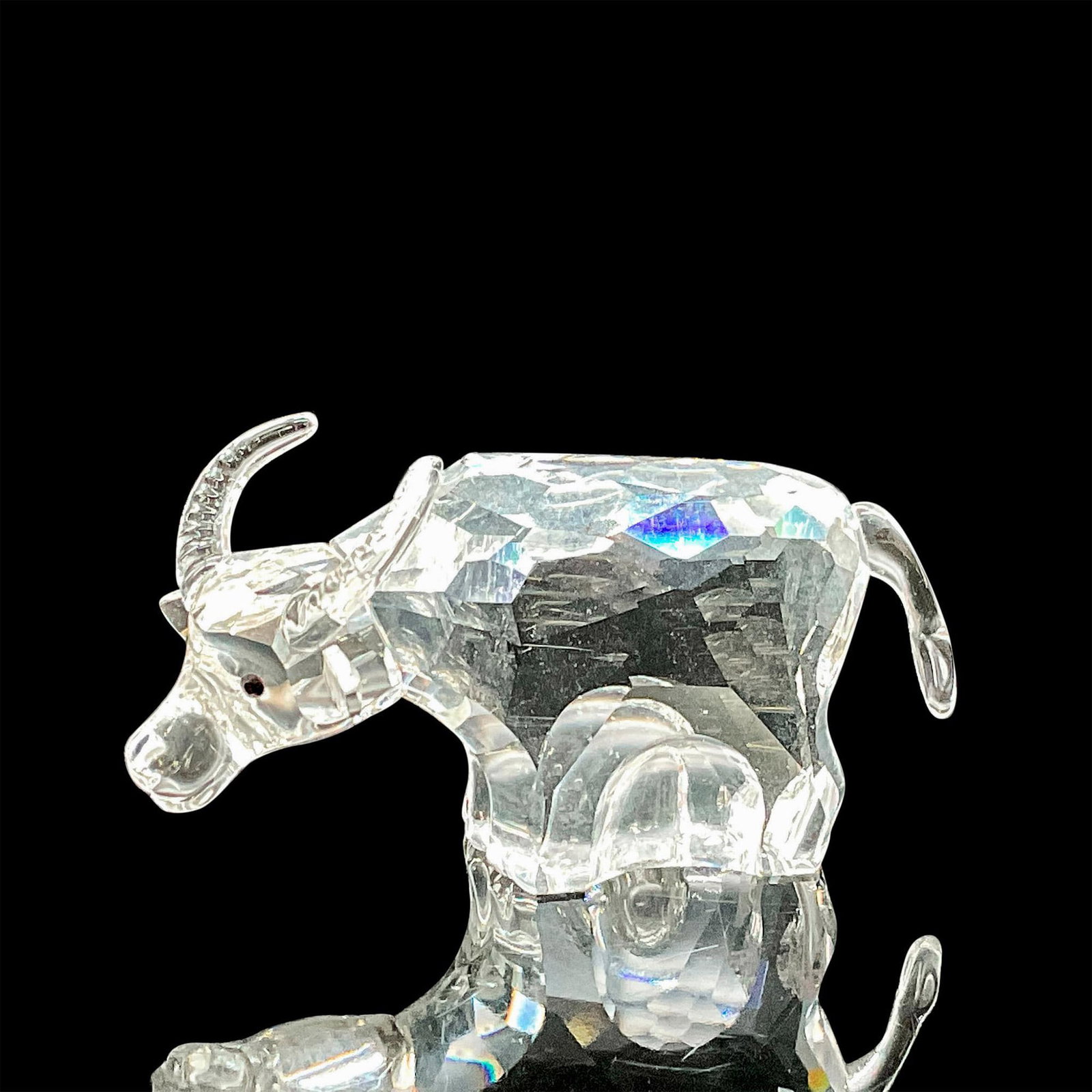 Swarovski Silver Crystal Figurine, Ox Zodiac: This Swarovski crystal ox was part of the Chinese Zodiacs collection. Made from clear crystal, the whole series of the small, clear Zodiac animals was made by a single designer. Chinese Years of the O