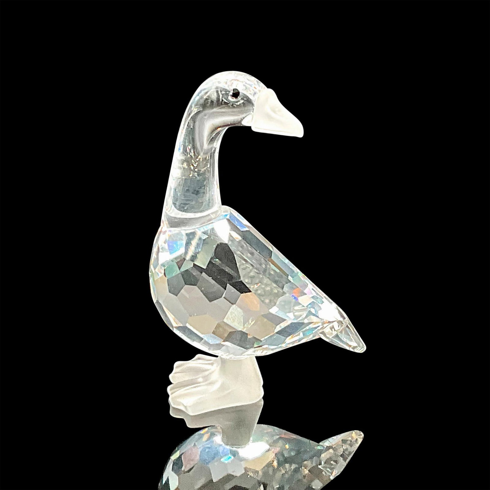 Swarovski Silver Crystal Figurine, Mother Goose: Figural is part of the Barnyard Friends group. Body is clear faceted crystal with black eyes. Beak and feet are frosted crystal. Swarovski backstamp. This item has its original box: 5"H x 3.25"dia. Ar