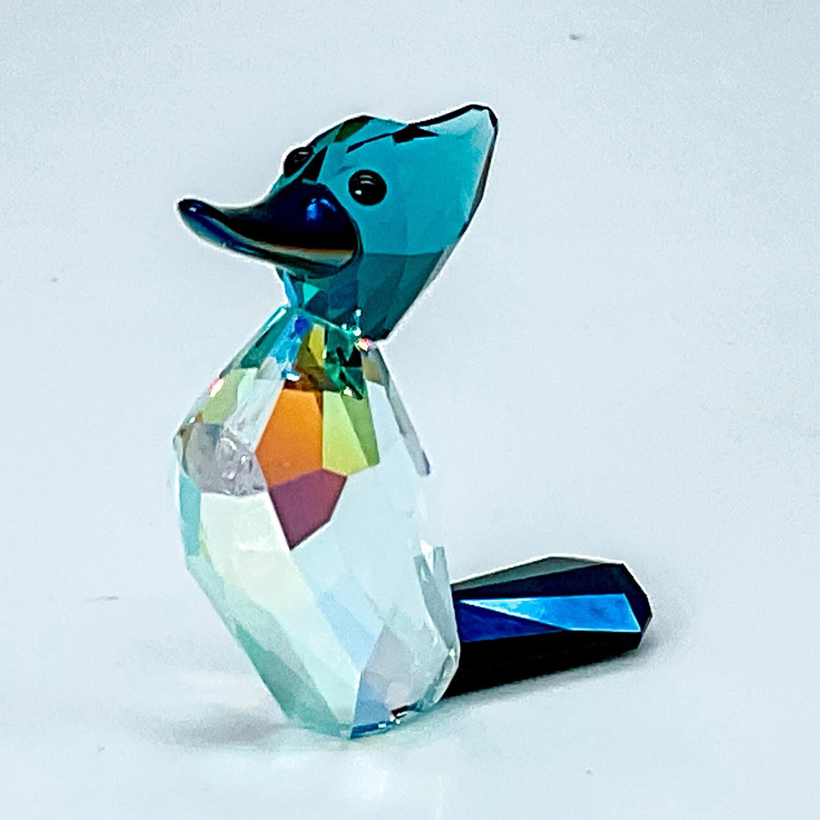 Swarovski Lovlots City Park Crystal Figurine, Ziggy: Sold as limited-edition piece in 2010. Body made from Aurora borealis crystal and light azure; head made from indicolite crystal. Lovlots Collection. Swarovski etched backstamp. This item has its orig
