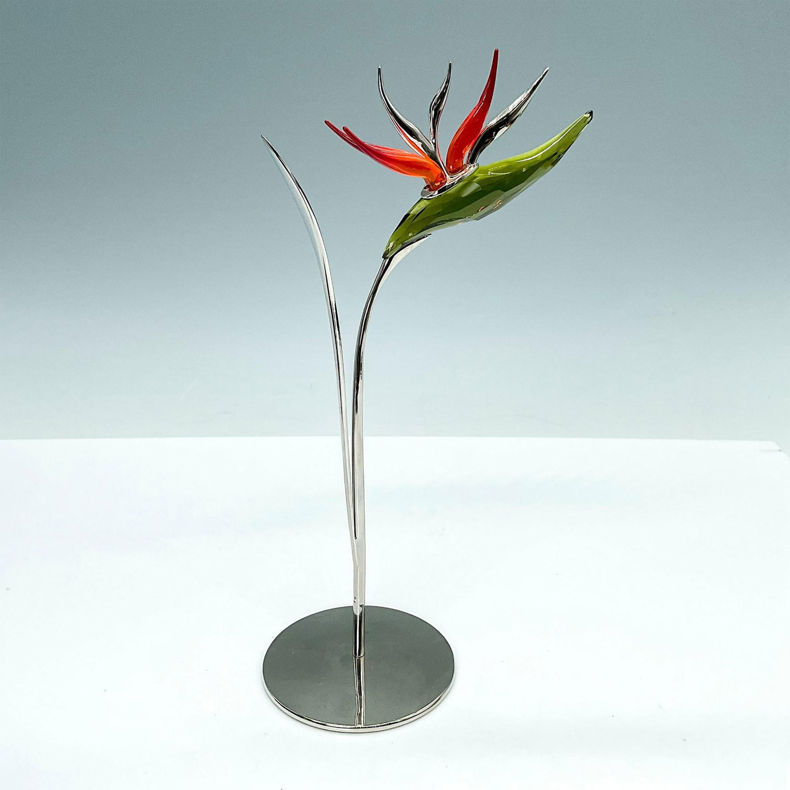 Swarovski Crystal Figurine, Dalmally Olive Birds of Paradise: Dalmally Olive Birds of Paradise, Dalmally Olive includes stand. Swarovski backstamp. Dalmally is part of the Swarovski Crystal Paradise collection and belongs to the category Tropical Flowers. This P