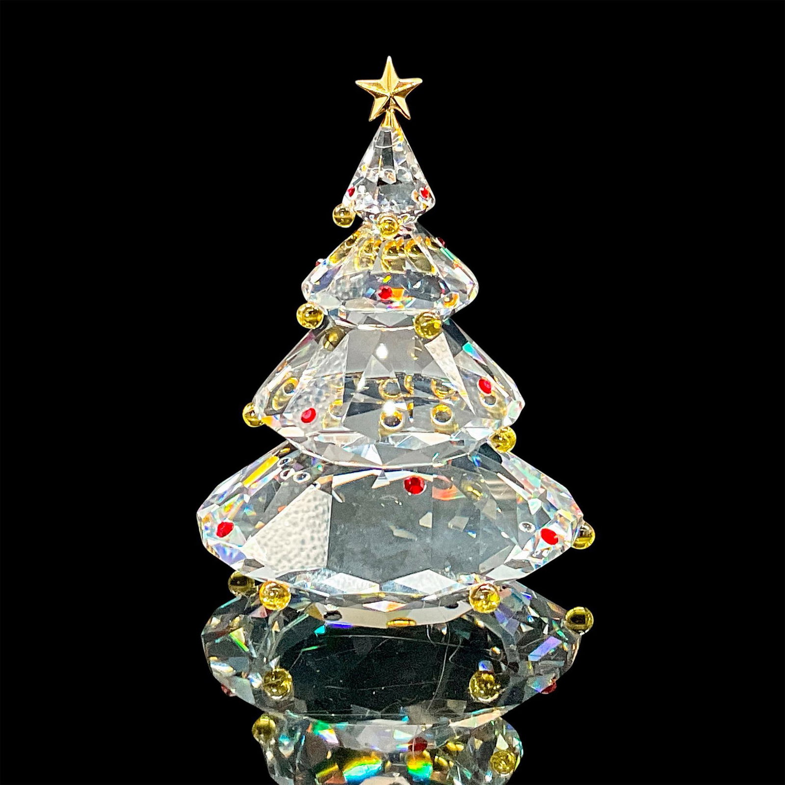 Swarovski Crystal Figurine, Christmas Tree: This tree was in the Cheerful Times group. The tree is topped with a metal star and has colored crystal ornaments on it. Swarovski etched backstamp. This item has its original box which measures 5"W x