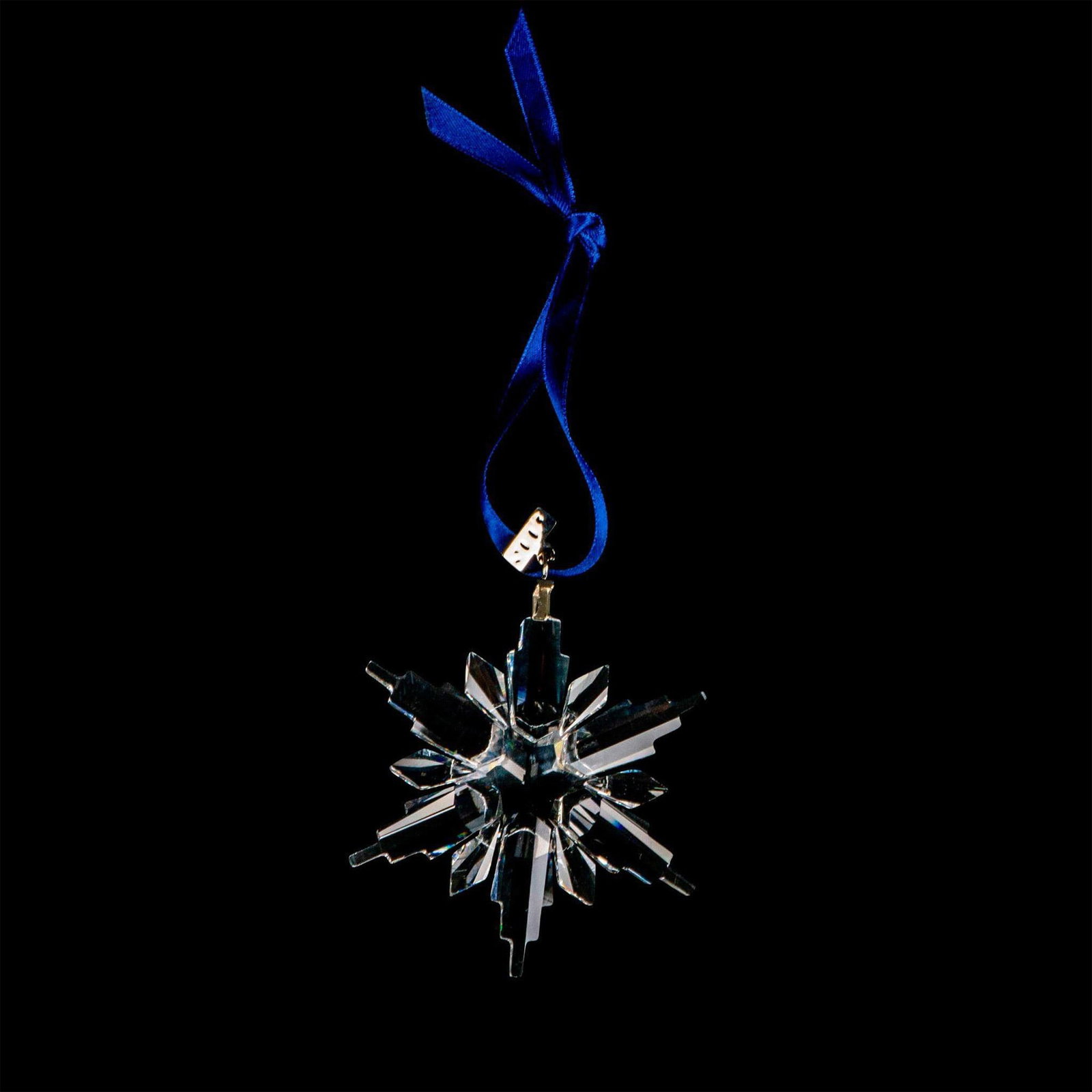 Swarovski Crystal Christmas Ornament, Snowflake 2002: This limited-edition Swarovski Christmas ornament has six long extensions, six short extensions, and a metal tag etched 2006. Swarovski etched backstamp. Includes original box: 6.5"L x 1.25"W x 6.5"H.