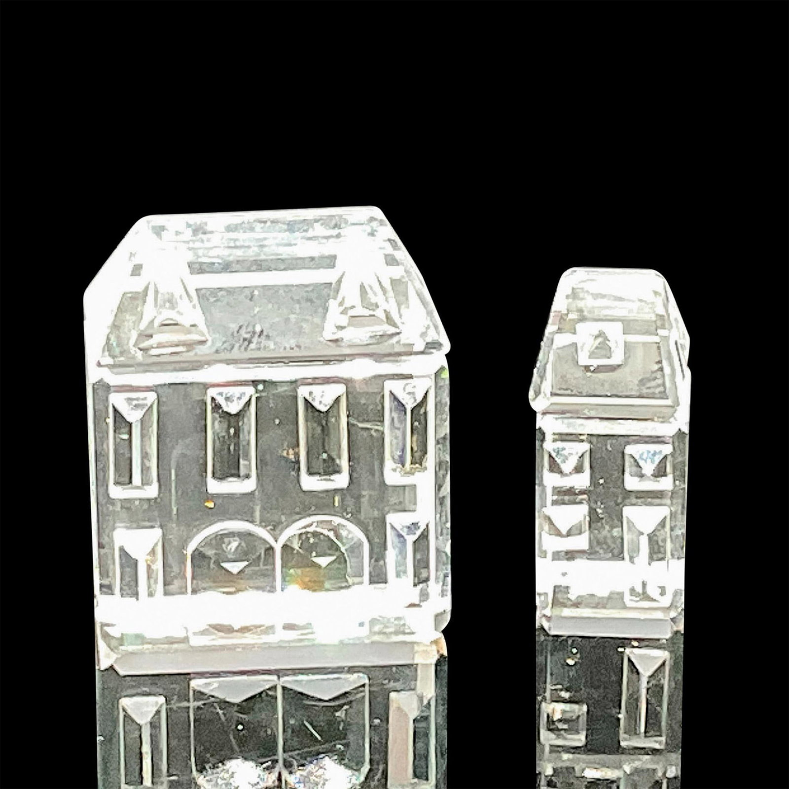 Swarovski Silver Crystal Figurines, City Houses: This Swarovski crystal set of two houses formed part of the Silver Crystal City group and they are made from clear crystal. These houses have 6 rectangular windows and 2 arched doors. Swarovski etched