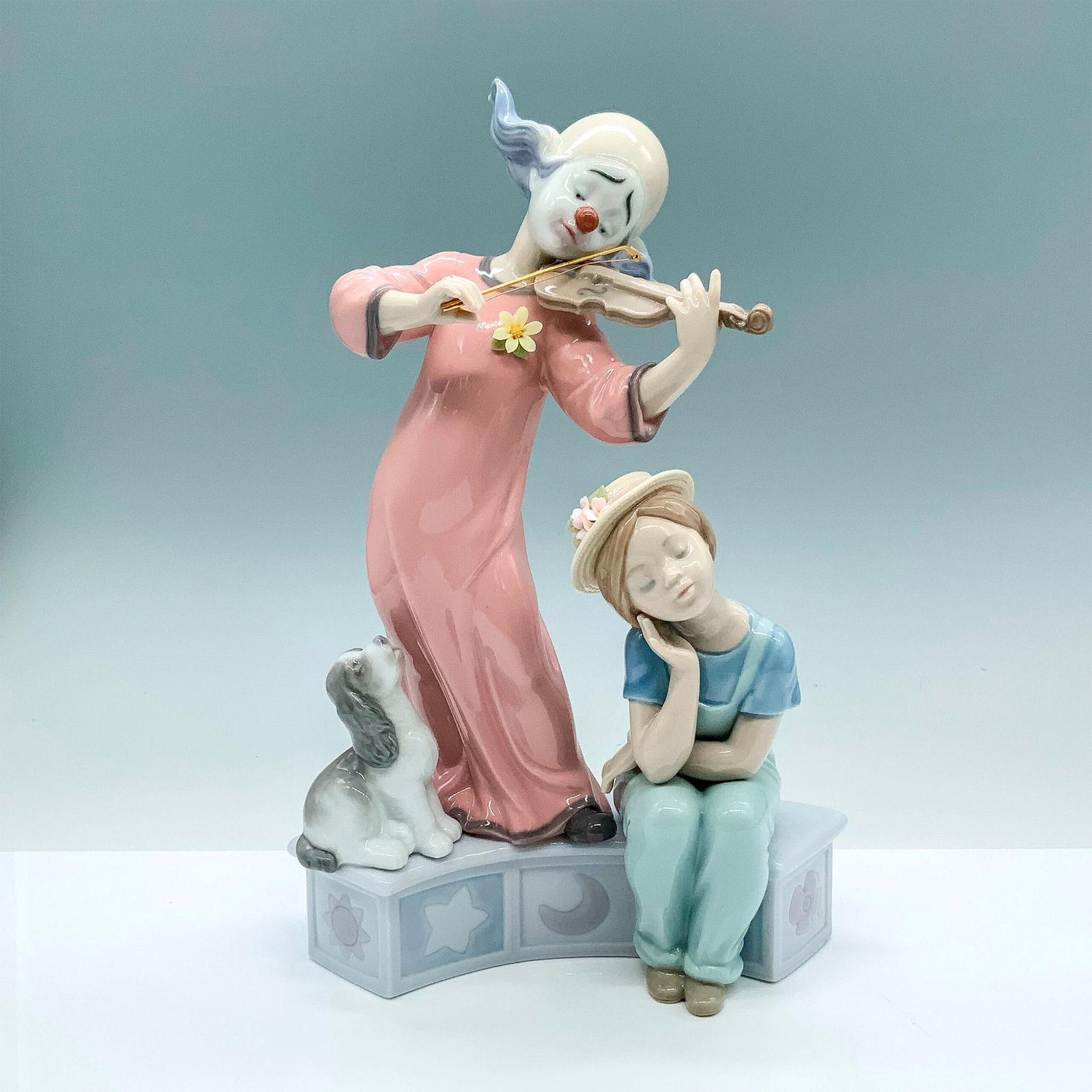 Music For A Dream 1006900 - Lladro Porcelain Figurine: Glossy finish; Lladro backstamp. Artist: Marco Antonio Nogueron Issued: 2002 - 2010 Dimensions: 11.5"H x 7.5"W Manufacturer: Lladro Country of Origin: Spain