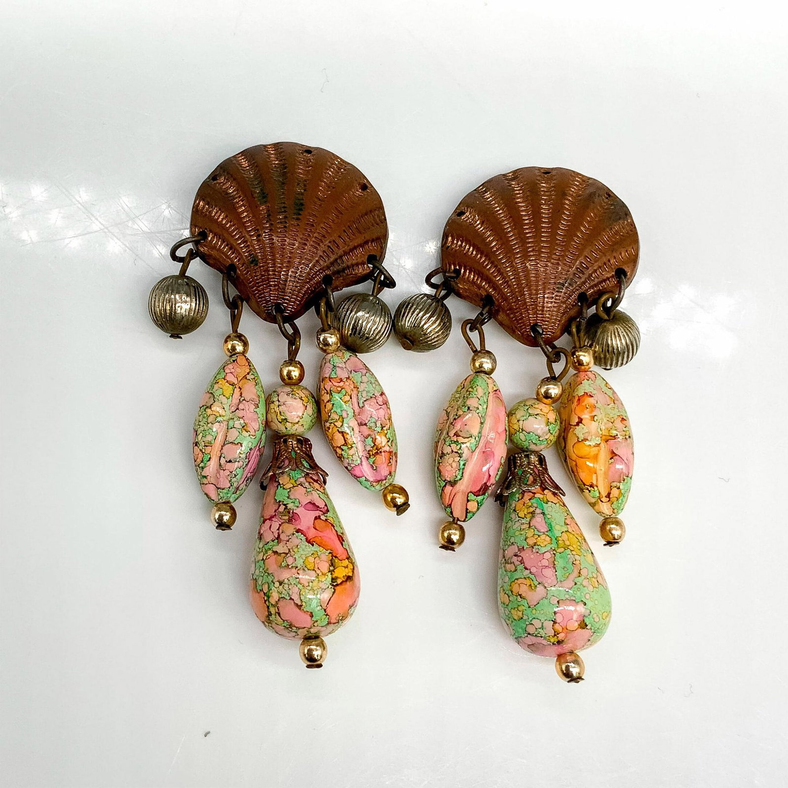 Fun Seashell and Pastel Beads Clip-On Earrings: Bronze seashells with dangling colorful pastel beads. Dimensions: 3"L x 1.25"W