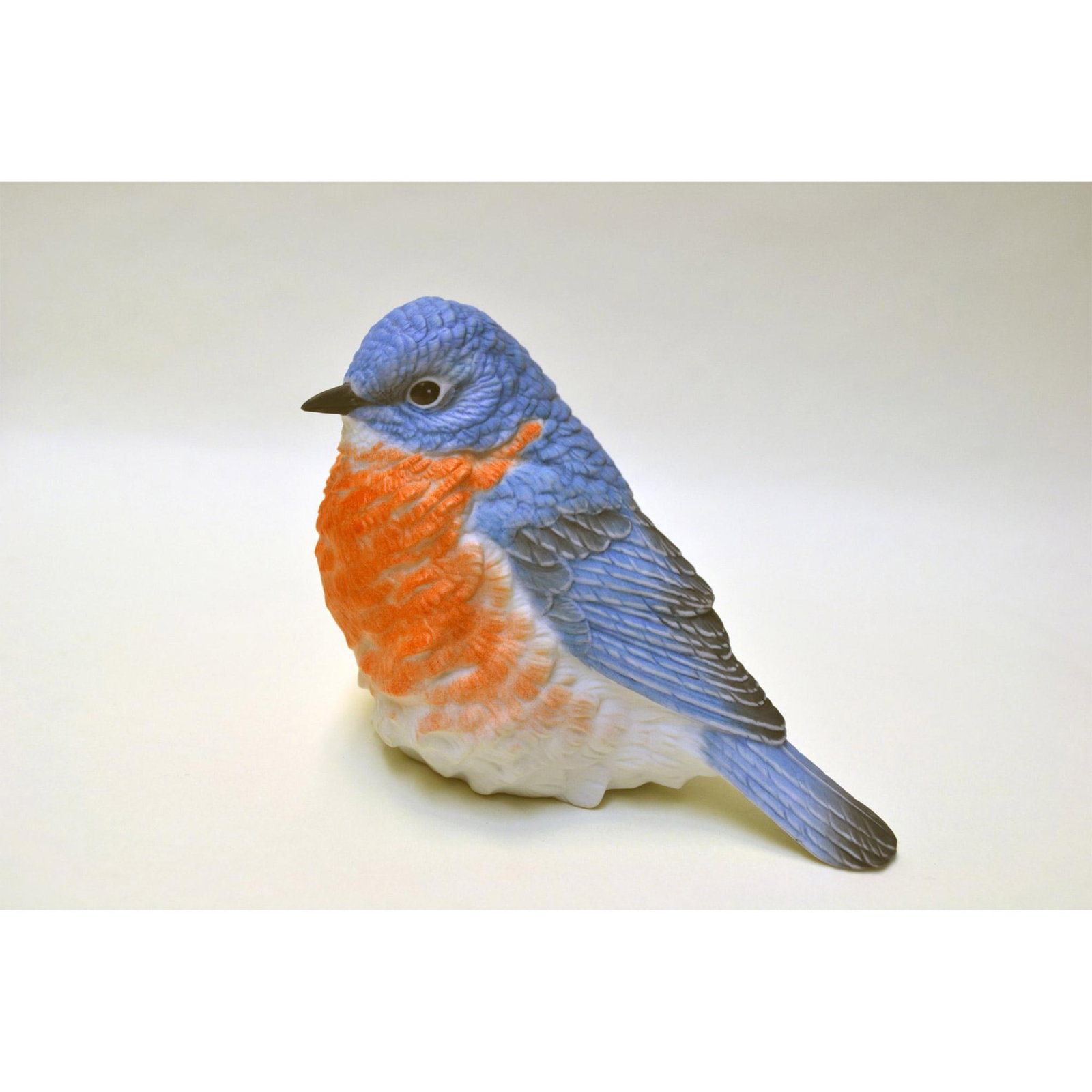 Oldham Porcelain Bluebird Figurine, Ap # 30, 1992: Bisque Porcelain Decorated, hand created, hand painted by Oldham, featuring the Bluebird, sitting. Issued: 1992. Hallmark: A.P. No 30. Origin: USA. Size: 3.30"h x 4.50"w x 2.50"d Artist: OLDHAM Issued