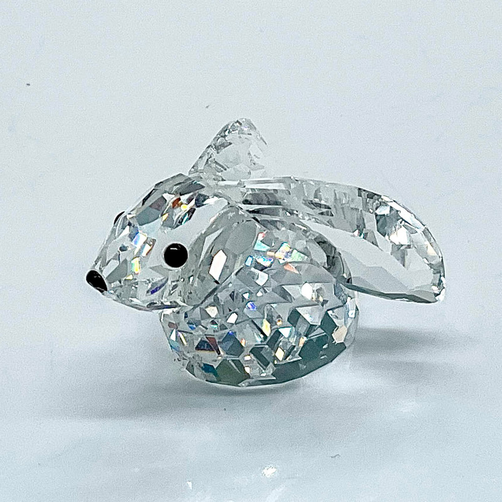 Swarovski Silver Crystal Figurine, Rabbit: Multifaceted clear crystal with black eyes and nose. Part of the In a Summer Meadow collection. Swarovski etched backstamp. This item has it's original box: 2.25" x 3.25"dia. Certificate of Authentici