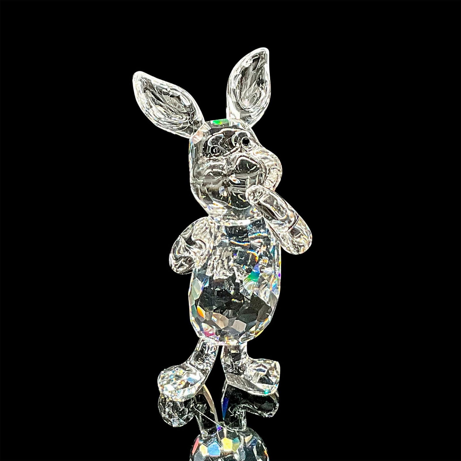 Swarovski Crystal Figurine, Disney's Piglet: Sparkling cut crystal figure of a Piglet from Winnie The Pooh standing with his hand at his mouth. Swarovski etched mark. Includes original box 4.75"H x 3.25"dia. Dimensions: 1"L x 1"W x 2.25"H Manufa