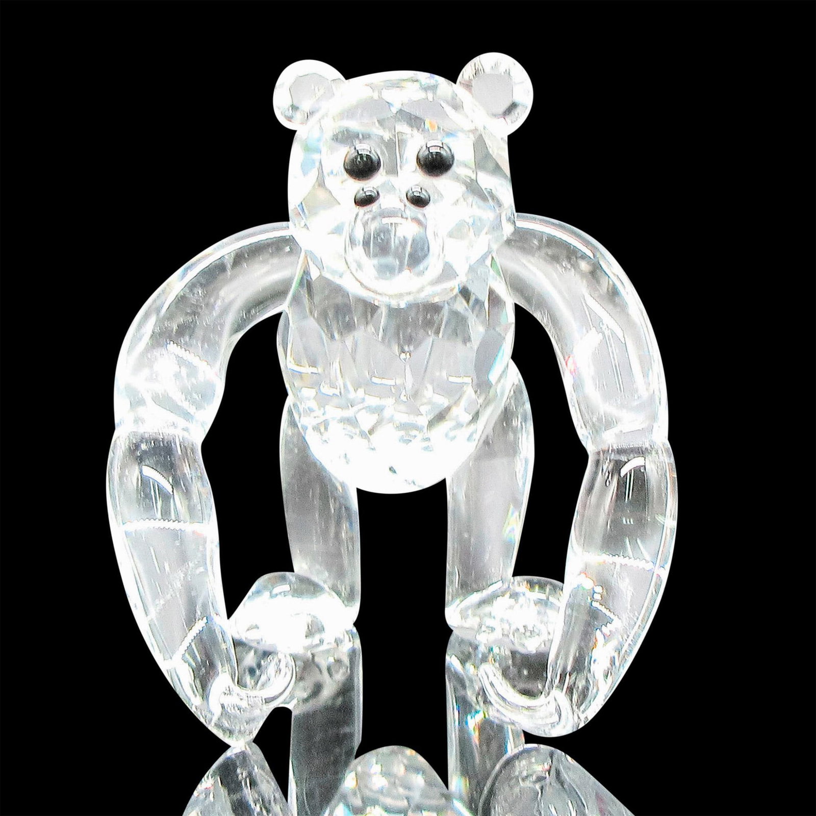 Crystal Florida Figurine, Monkey: Clear smooth arms, legs and tail on faceted face and body. Black eyes and nose. Dimensions: 1.75"L x 2.5"W x 2.25"H Manufacturer: Crystal Florida Country of Origin: United States