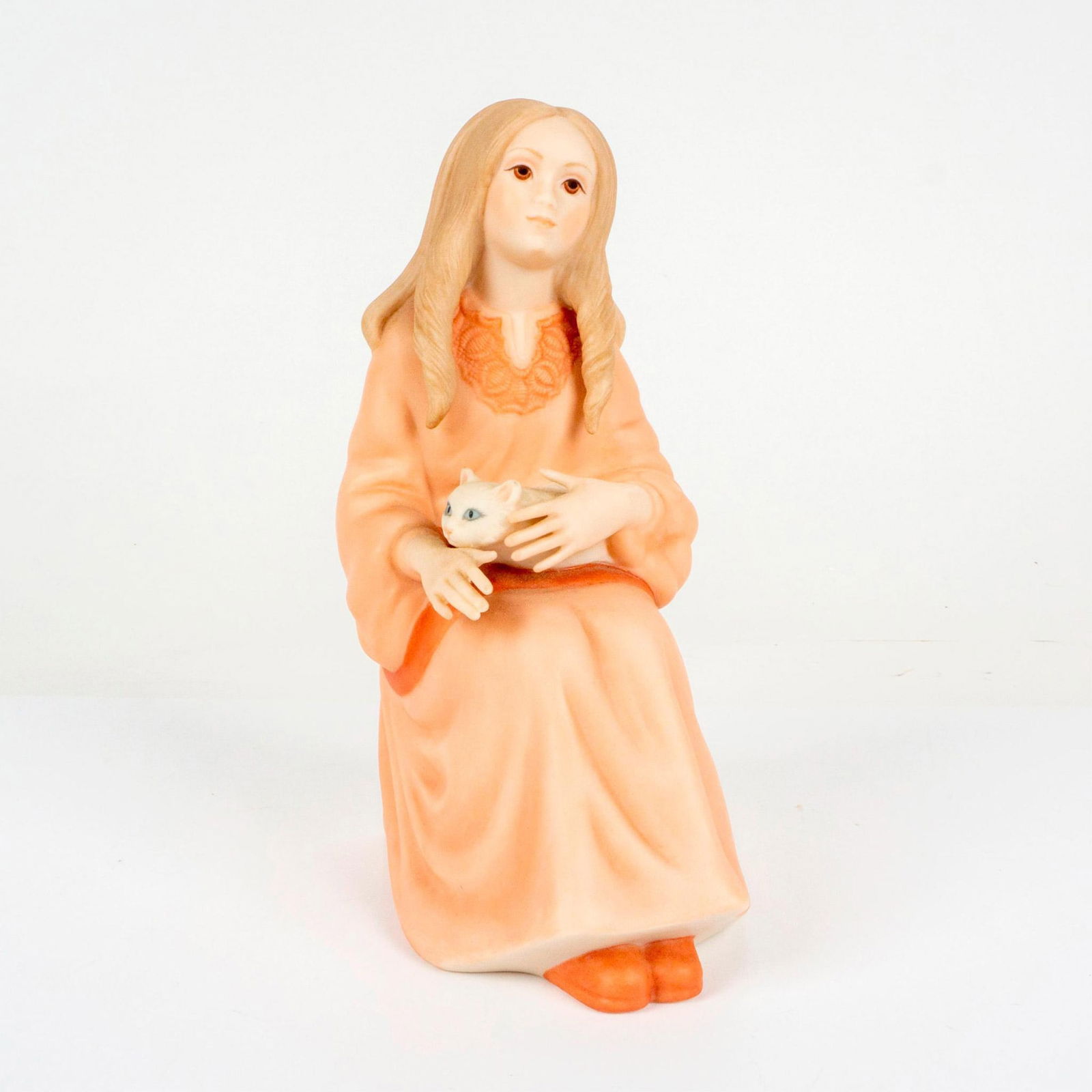 Goebel Porcelain Figurine, Katrina With Cat: Designed by world renowned sculptor. Features a young woman in peach toned coloration seated with a feline on her lap. Artist name printed to bottom of piece. Goebel Crafts of North America backstamp.