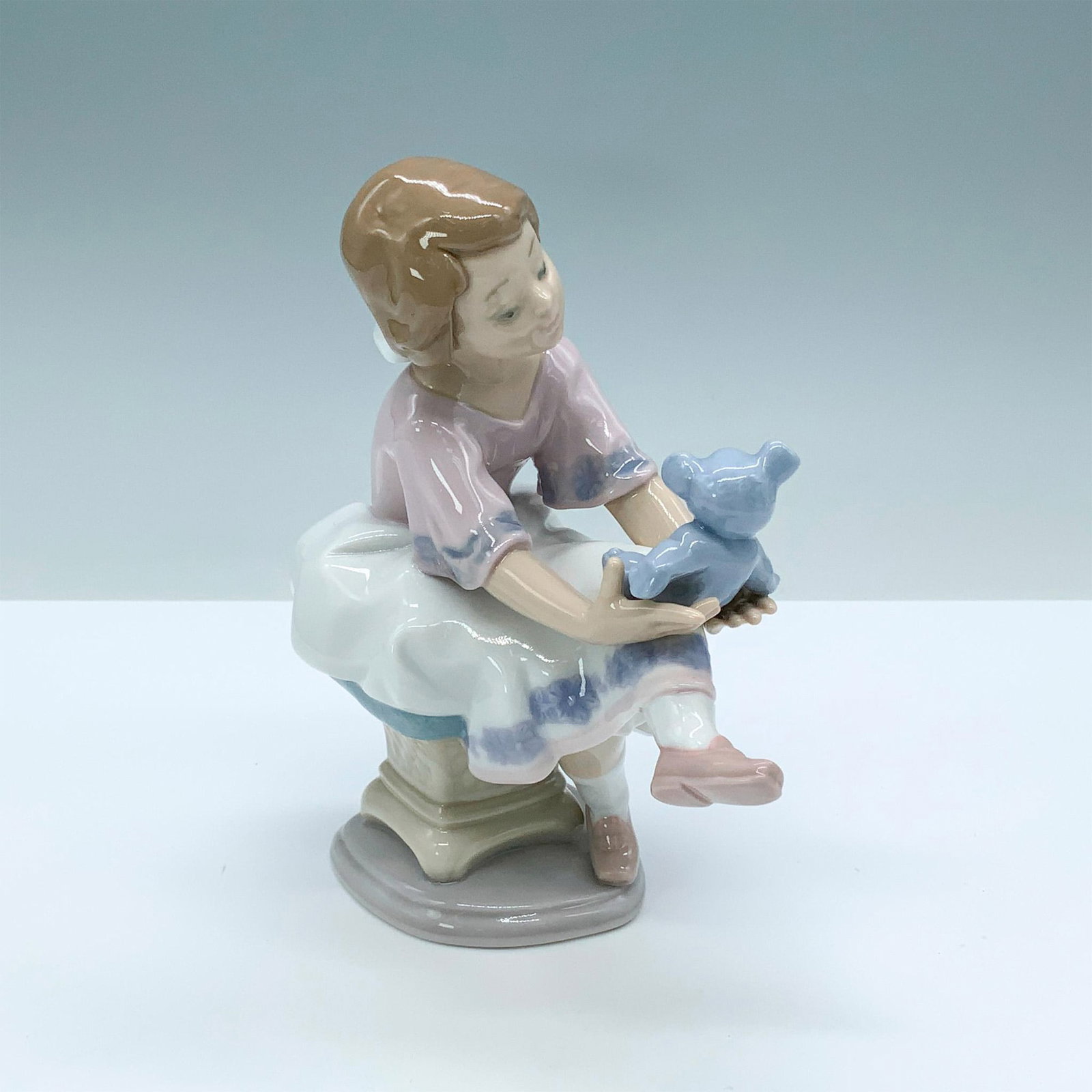 Best Friend 1007620 - Lladro Porcelain Figurine: Glossy finish; Lladro backstamp. Box measures: 9.25"L x 6.5"W x 10"H. Artist: Francisco Polope Issued: 1993 - 1993 Dimensions: 6.25"H x 5"W Manufacturer: Lladro Country of Origin: Spain