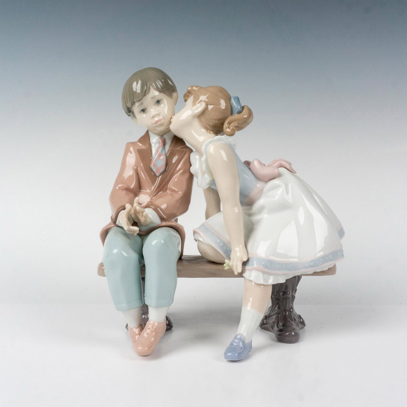 Ten & Growing 1007635 - Lladro Porcelain Figurine: Glossy finish; Lladro backstamp. Box measures: 9"L x 8"W x 10"H. Artist: Francisco Polope Issued: 1995 - 1995 Dimensions: 7.75"H x 7"W Manufacturer: Lladro Country of Origin: Spain