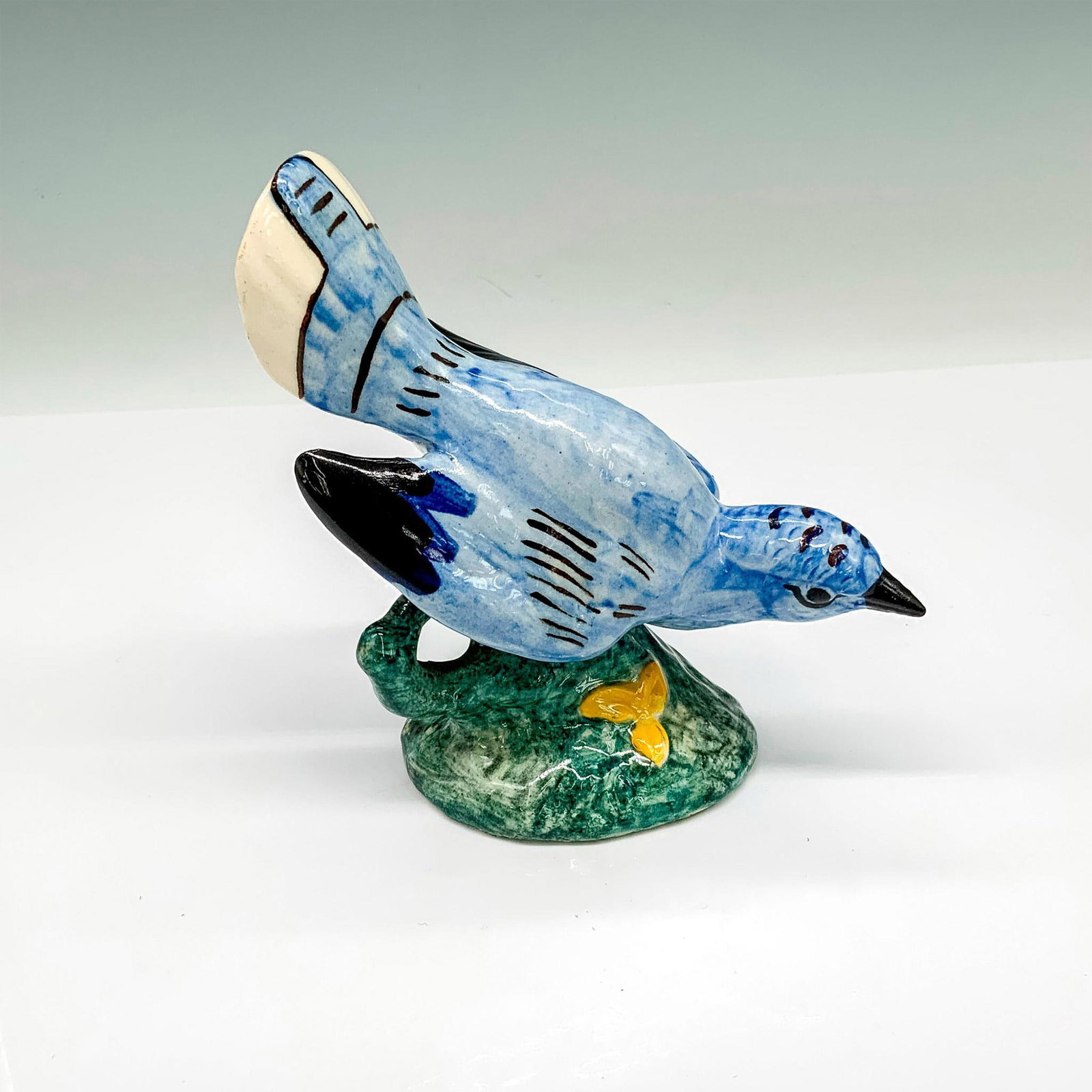 Stangl Pottery Bird Figurine, Blue Bird 3276: Blue bird with a glossy finish. Stangl mark and artist initials JGF are on the bottom. Dimensions: 5.2"L x 3"W x 5"H Manufacturer: Stangl Pottery Country of Origin: United States