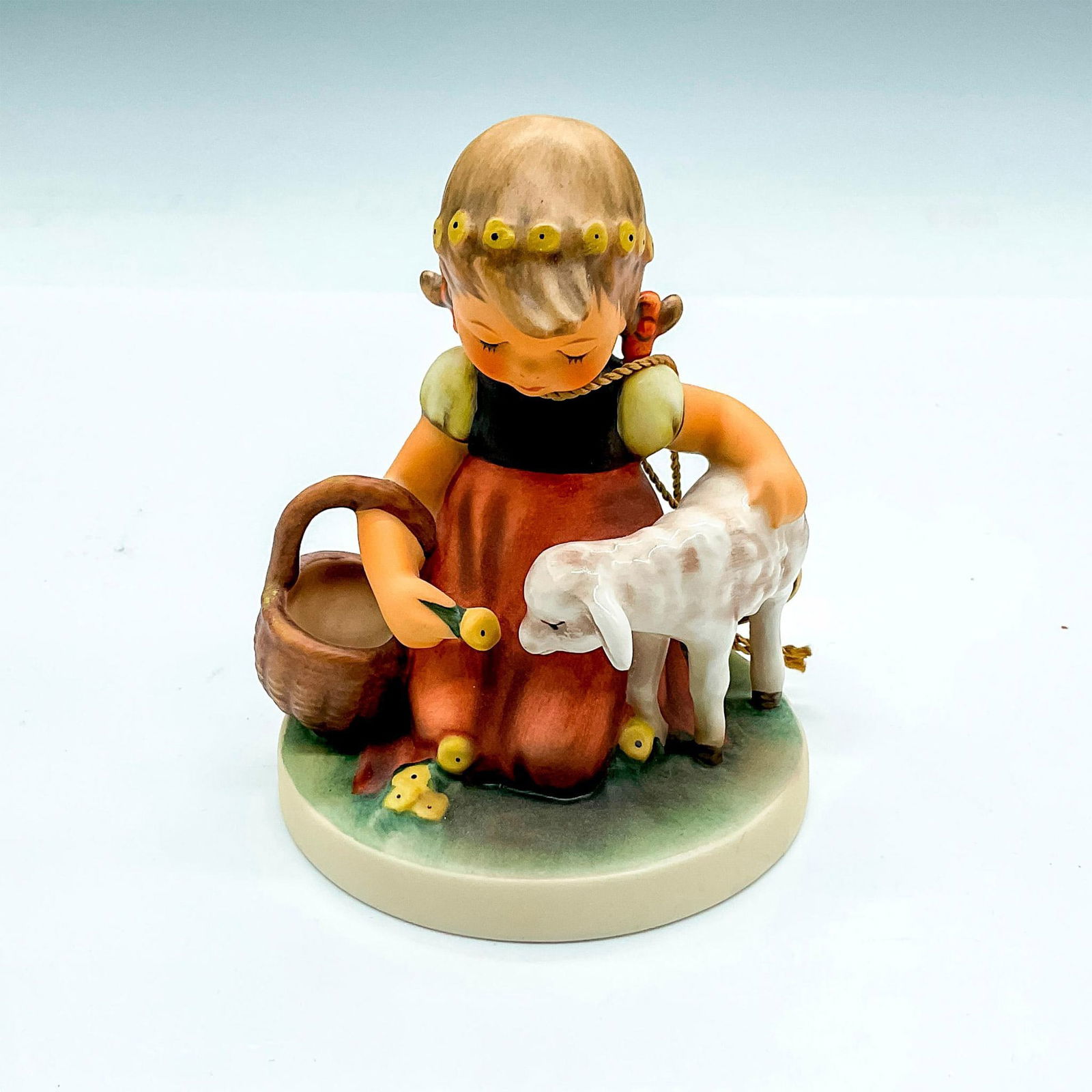 Goebel Hummel Porcelain Figurine, Favorite Pet: Retirement Exclusive 2001, hand painted girl with a basket and lamb. Goebel Germany backstamp. Impress mark 361. Issued: 2001 Dimensions: 4"H x 3" dia. Manufacturer: Goebel Hummel Country of Origin: G