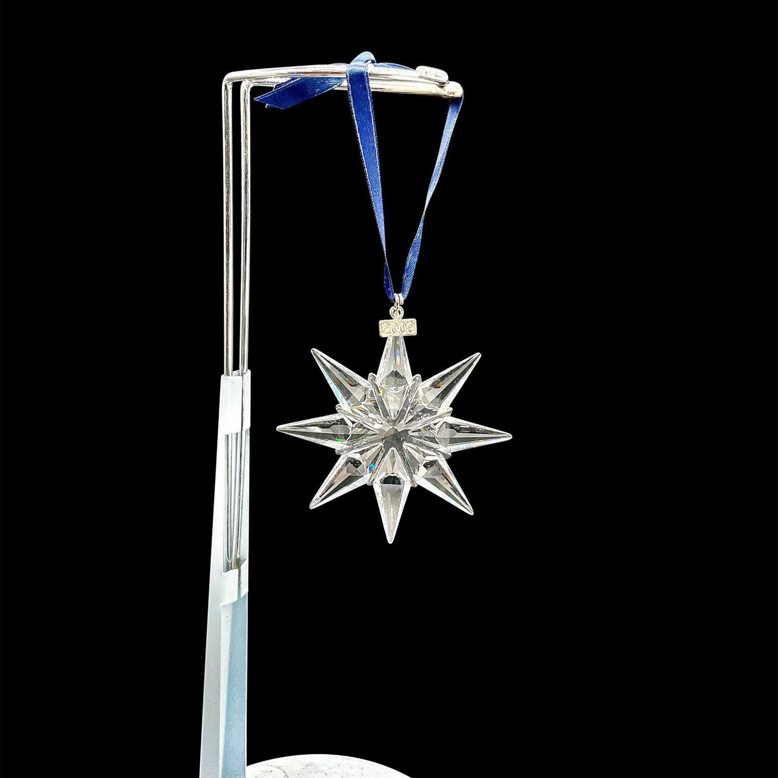 Swarovski Crystal Christmas Ornament 2009: Dazzling clear crystal star shaped tree ornament. Swarovski mark. This item has its original box: 5.5"L x 6.25"W x 1"H. Dimensions: 3.5"H x 2.75"W Manufacturer: Swarovski Country of Origin: Austria
