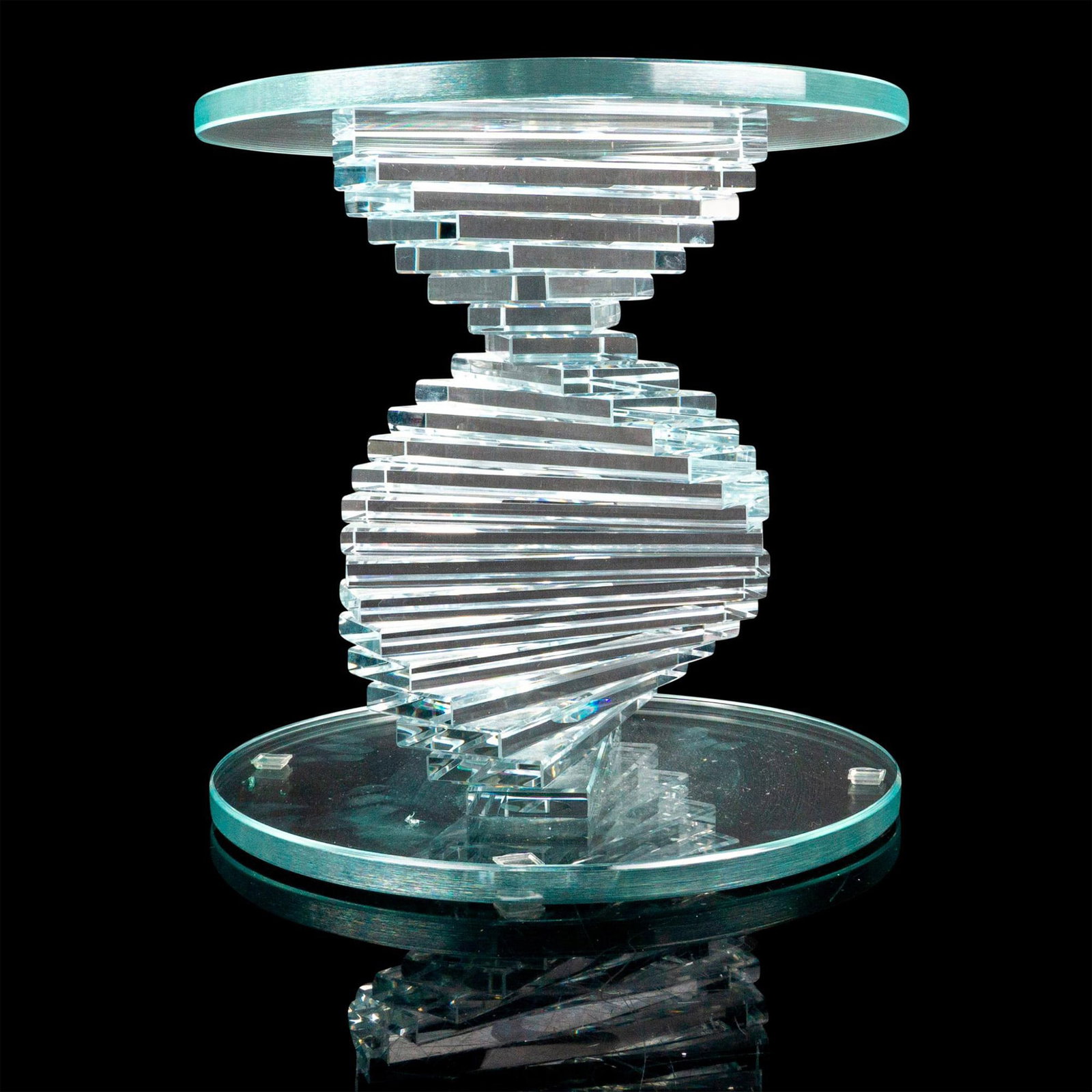 Helix Spiral Modern Glass Base: A clear stand for a vase or figurine with a spiral column between a disk-shaped top and bottom. Dimensions: 10"W x 10"H Provenance: Marie-Claude Lalique private collection.