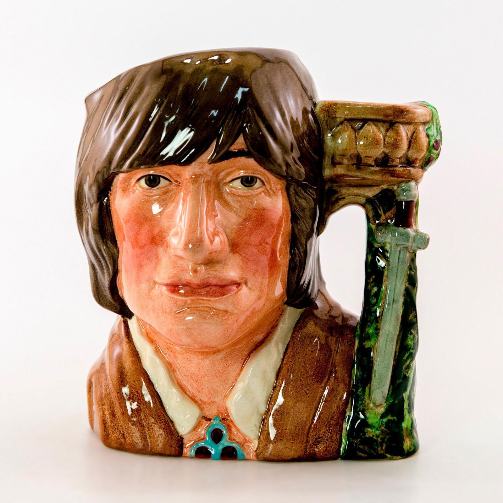 Romeo D6670 - Large - Royal Doulton Character Jug: The Shakespearean Collection. Dagger and balcony handle. Royal Doulton backstamp. Artist: David B. Biggs Issued: 1983 - 1989 Dimensions: 7.5"H Manufacturer: Royal Doulton Country of Origin: En