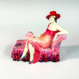 Dulcinea HN1419 - Royal Doulton Figurine: Glossy porcelain, Art Deco style; modeled as a musician fashionista lounging. Handwritten title, HN and Potted by Doulton & Co. Royal Doulton backstamp. Artist: Leslie Harradine Issued: 1930 - 1938 Di