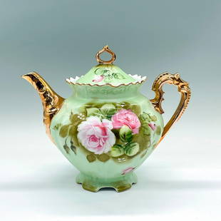 Vintage Lefton China Porcelain Heritage Green Teapot: A beautiful covered green teapot adorned with pink roses and gilded trims. Lefton China backstamp. Dimensions: 9"L x 6.25"W x 7.75"H Manufacturer: Lefton China Country of Origin: Japan