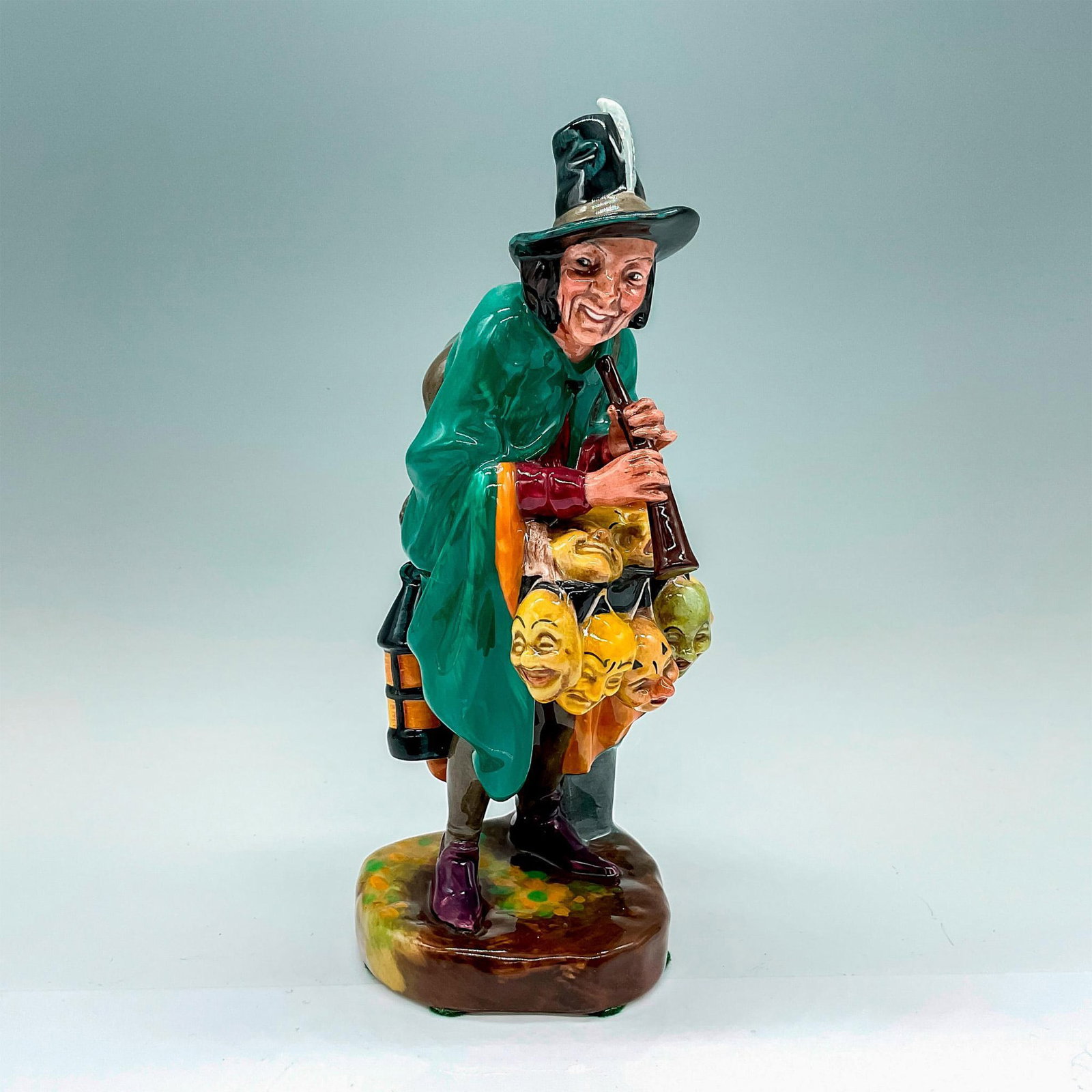 Mask Seller HN2103 - Royal Doulton Figurine: Artist: Leslie Harradine Issued: 1953 - 1995 Dimensions: 8.5"H Manufacturer: Royal Doulton Country of Origin: England