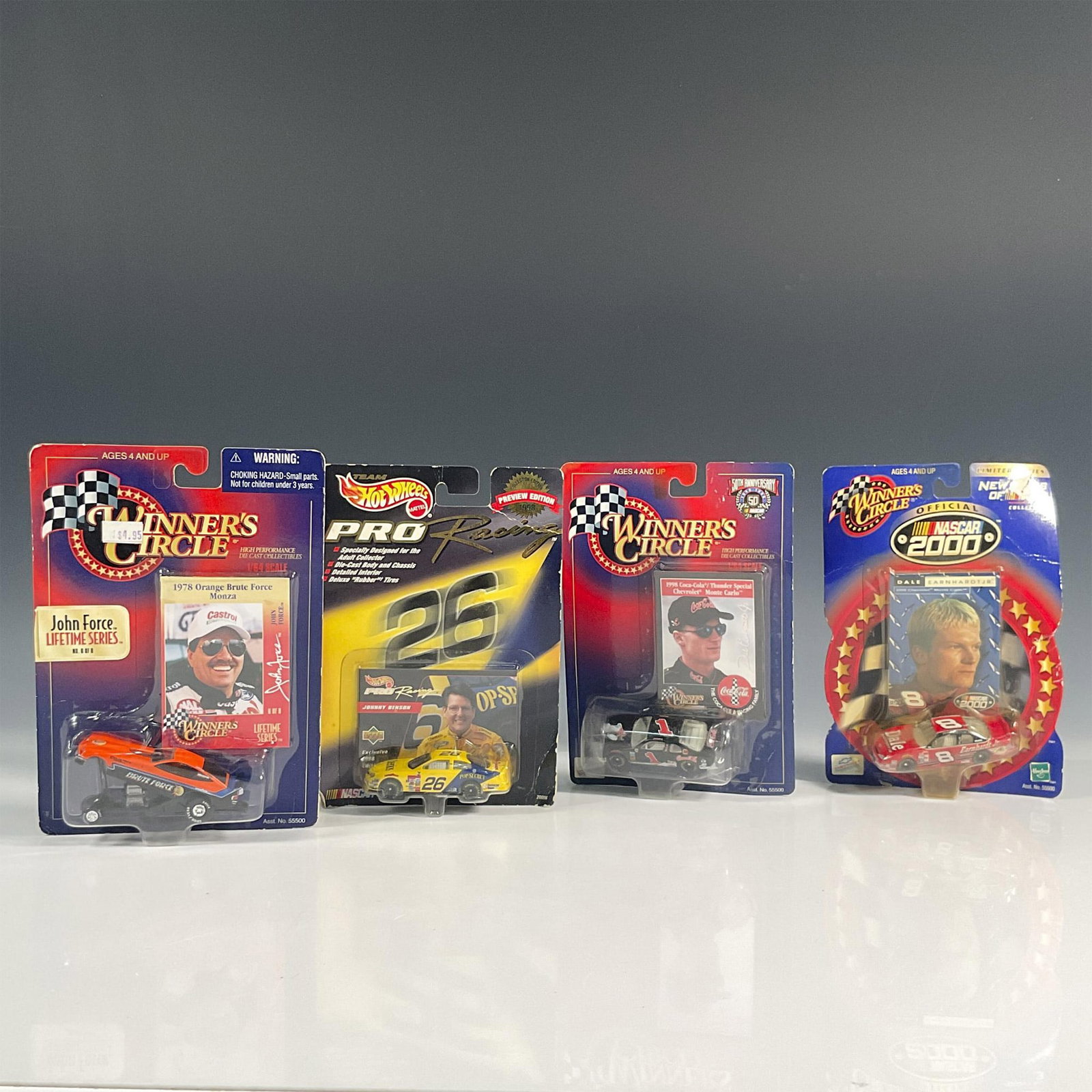 4pc Winners Circle and Hot Wheels Toy Cars, Nascar Drivers: Accelerate your collection's prestige with these NASCAR-themed toy cars, with 3 Winner's Circle vehicles that are their drivers—1978 for John Force, and 1998 and 2000 for Dale Earnhardt Jr., alongsi