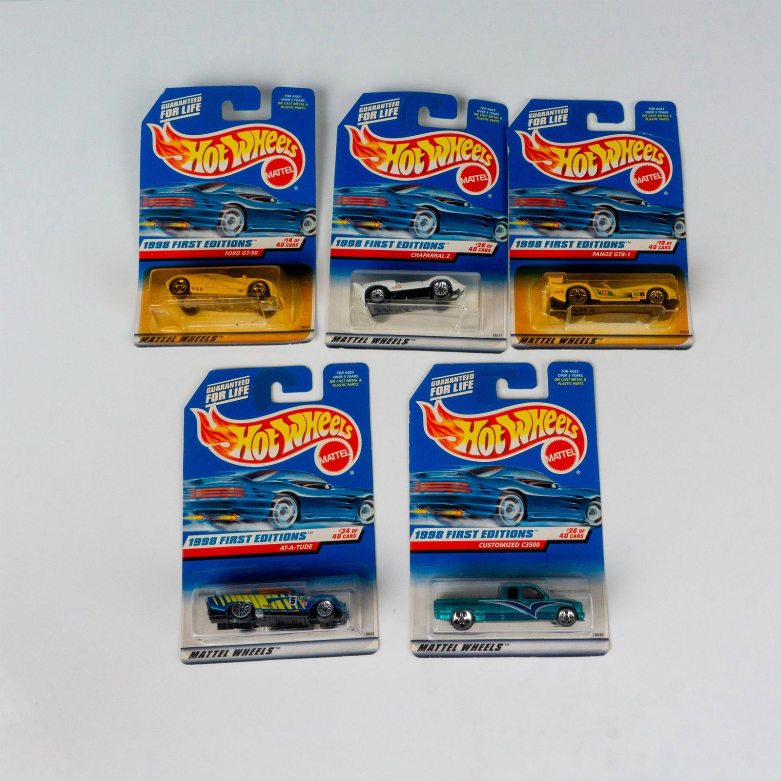 5pc 1st Ed. 1998 Hot Wheels Toy Cars: A set of 5 Hot Wheels toy cars from the 1998 first edition line that consists of the At-A-Tude (34 of 40), the Panoz GTR-1 (19 of 40), the Ford GT-90 (14 of 40), the Customized C3500 (26 of 40), and t