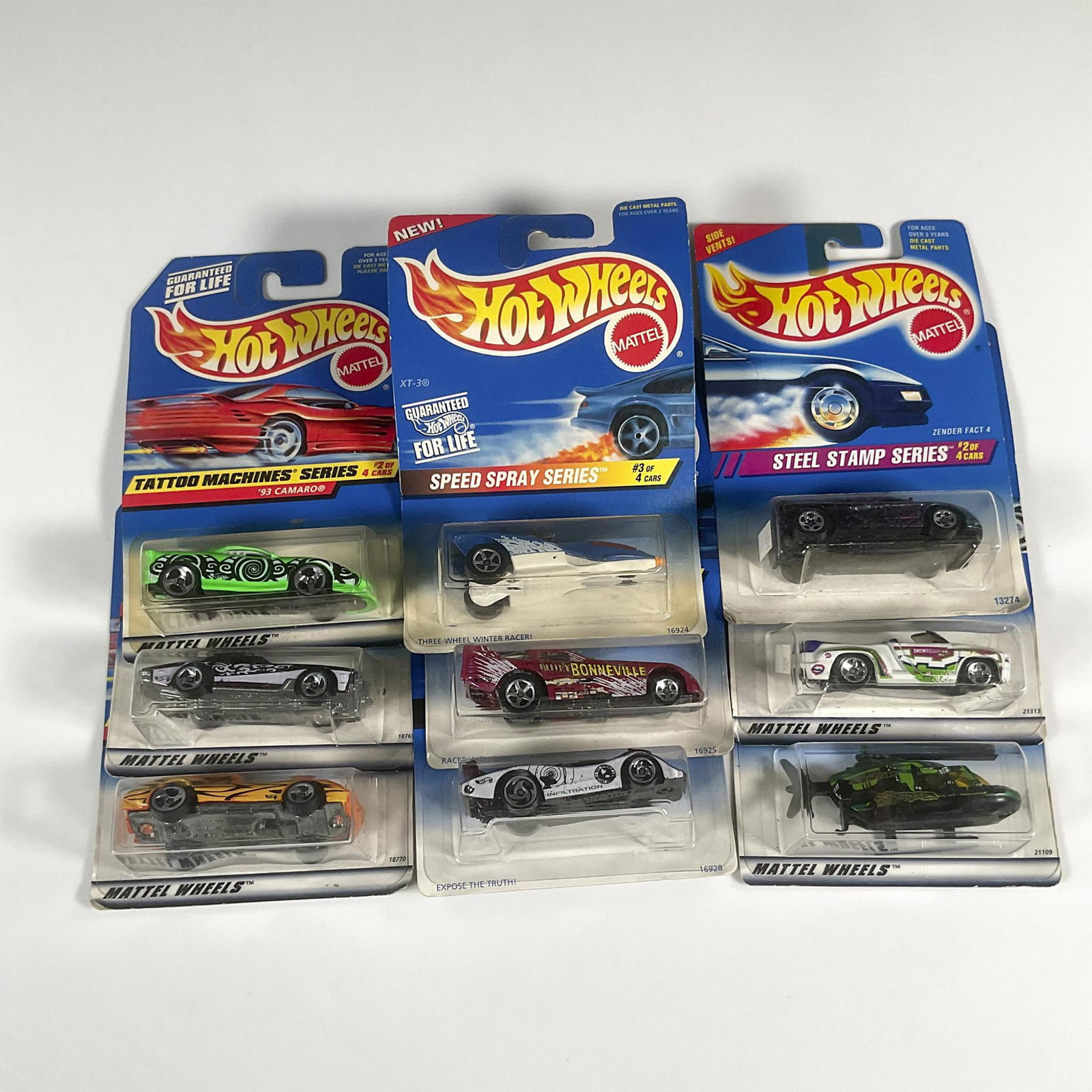 9pc Hot Wheels Toy Cars, Variety Set: A set of 9 Hot Wheels cars from multiple collection series that includes the Zender Fact 4 (Collector #287), Dodge Sidewinder (Collector #965), the Proper Chopper (Collector #950), the XT-3 (Collector