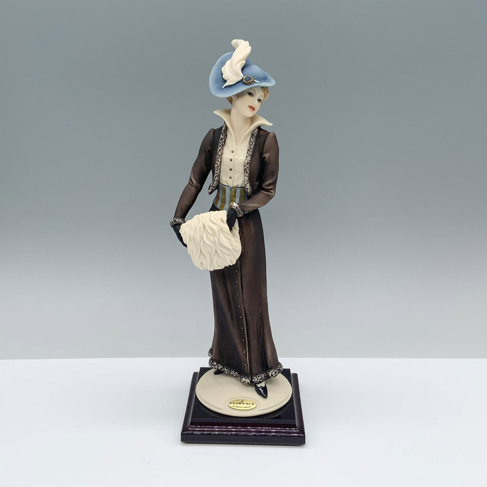 Florence Sculture d'Arte Giuseppe Armani Figurine, Coquette 1306C: Figurine on a wooden base. It is signed at the bottom. Florence Sculture d'Arte affixed label. Artist: Giuseppe Armani Dimensions: 3.25"L x 3.25"W x 10"H Manufacturer: Florence Sculture d'Arte Country
