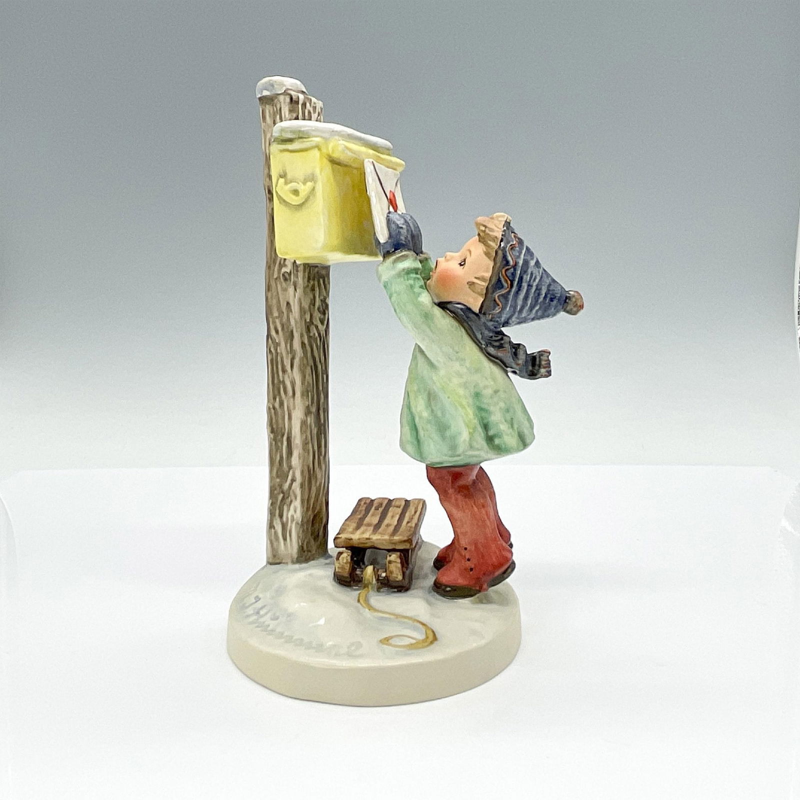 Letter to Santa HUM340 - Goebel Hummel Figurine: Hand-painted porcelain figurine depicting young boy excitedly posting his letter to Santa. Goebel TMK5. Issued: 1972-1979 Dimensions: 4.75"L x 4"W x 7"H Manufacturer: Goebel Hummel Country of Origin:
