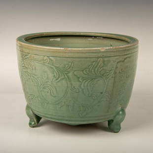 Chinese Ming Dynasty Celadon Kikuri Gold Restored Planter: A rare and beautiful celadon green glaze tri-footed jardiniere featuring flowers with spiral stems. What is rare is the crack restored by gold fillings, a technique called Kintsugi. Ming Dynasty mark