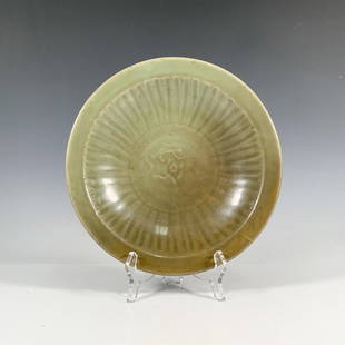 Ming Dynasty Longquan Celadon Peony Deep Bowl: Beautiful Chinese celadon glazed bowl with an impressed peony design to the center. The interior of the curved wall with carved vertical lines, creating a sunburst effect. Issued: 14th-15th c.